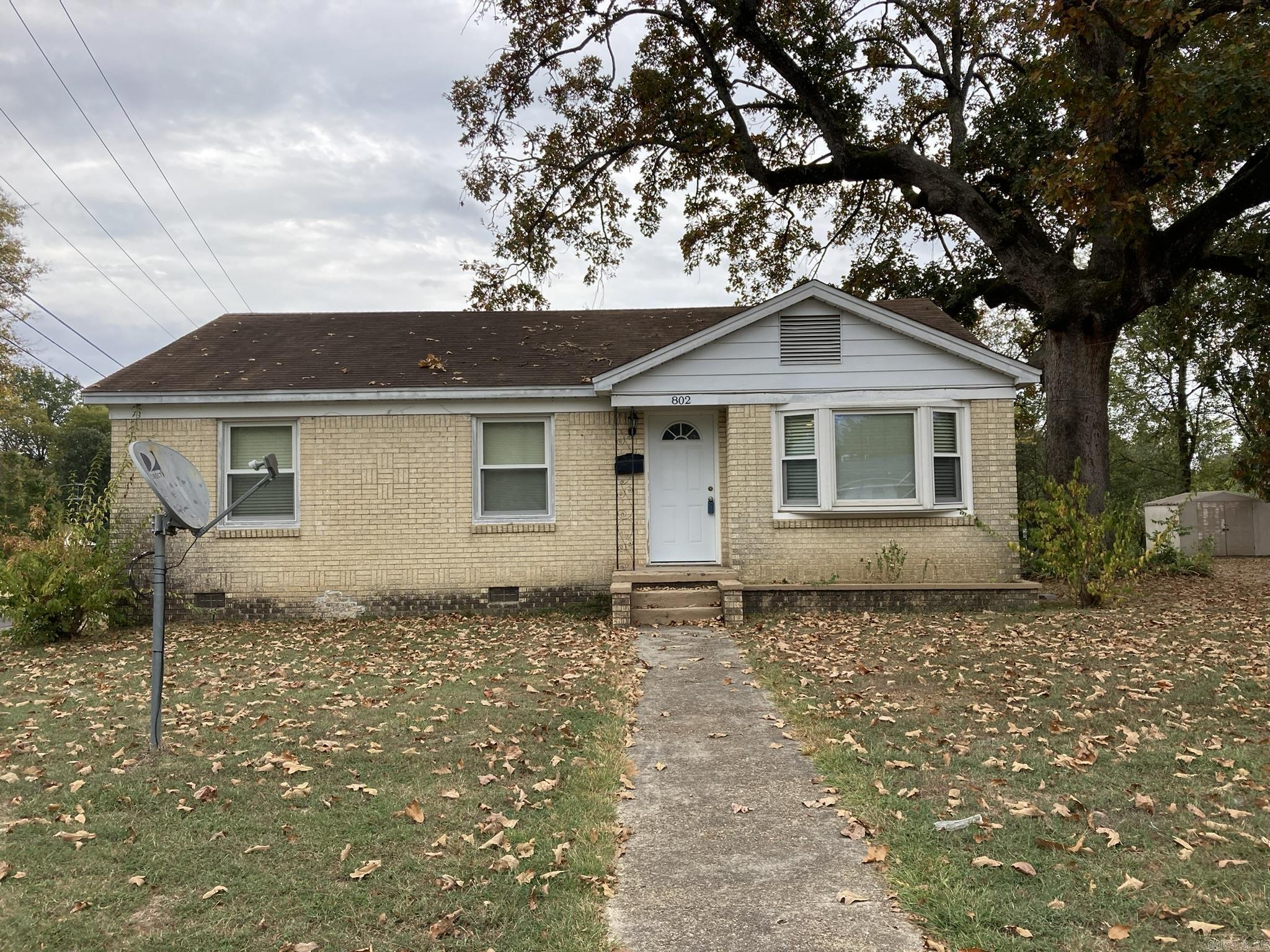 CHARMING ALL BRICK HOME LOCATED CLOSE TO DOWNTOWN BENTON. FEATURES A LARGE CORNER LOT AND ORIGINAL HARDWOODS IN ALL ROOMS EXCEPT TILE IN KIT. AND BATH.  GAS COOK STOVE AND HOT WATER HEATER ABOUT 3 YRS. OLD. FRIG AND WASHER AND DRYER ABOUT 7 YRS AND CONVEY WITH HOME. LIVING ROOM AND DINING AREA ARE AN OPEN AREA WITH A BAY WINDOW FACING STREET. SELLER HAS H&A SERVICED TWICE A YR BY NORTHSIDE. OUTSIDE ARE 2 STORAGE SHEDS AND A 2 CAR CP WITH STORAGE ROOM AT ONE END. PROPERTY IS BEING SOLD " AS IS".