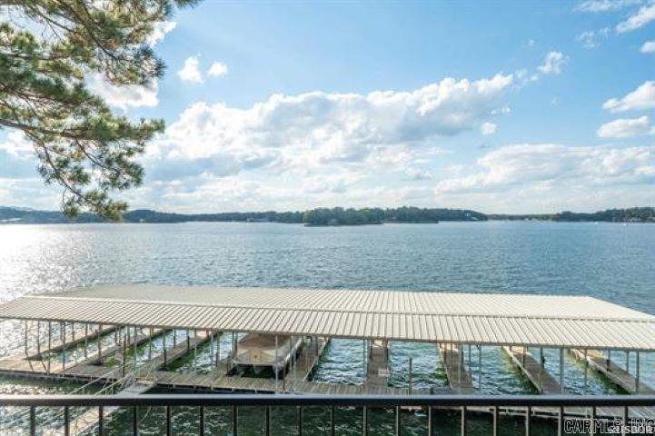 This 7 south level entry condo on Lake Hamilton allows short term rentals. This unit is located in the coveted 9 building at the Landing, which has the best views of  the main channel.  You can watch the seasonal fireworks show directly from your balcony. Comes with everything including a boat slip. Owner/agent