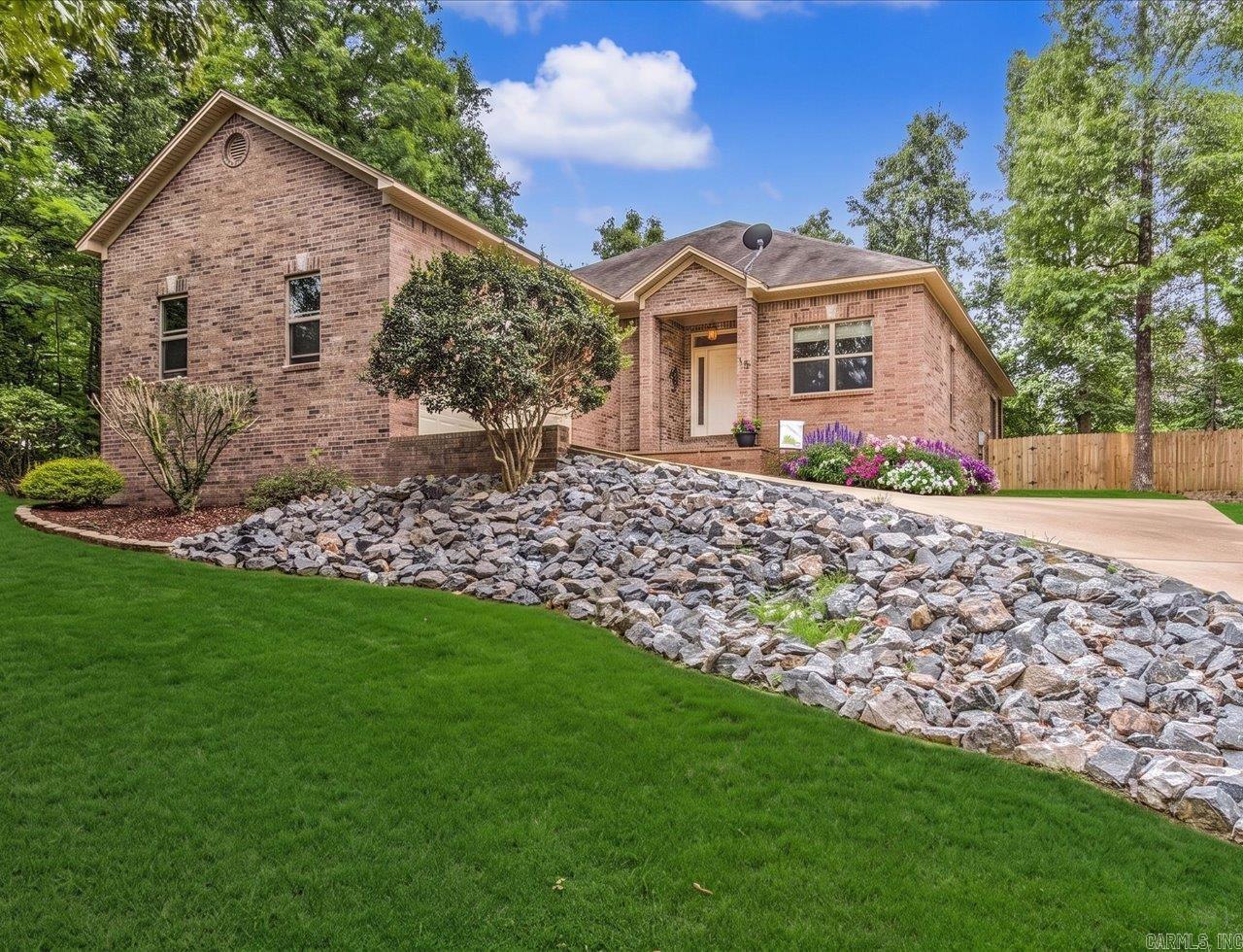 Elegance Meets Golf & Lake Living Nestled in a quiet, serene cul-de-sac, this stunning all-brick home offers the perfect blend of, comfort and low-maintenance living. Located within a premier golfing and boating community, you’ll enjoy a vibrant lifestyle packed with neighborhood activities, community events, and a local library just moments away.  Inside, the home is designed for both entertaining and effortless daily living. The expansive layout features easy-to-clean concrete floors that flow beautifully throughout the main living areas. At the heart of the home is a magnificent double-sided fireplace, creating a warm and inviting ambiance that can be enjoyed from multiple rooms. The backyard is fully fenced for all of your loved ones!  The gourmet kitchen is a chef’s delight, complete with a spacious breakfast bar for casual mornings, while a separate formal dining room provides the ideal backdrop for hosting dinner parties.  A private oasis boasting an impressive ensuite bath equipped with dual showers. Whether you are looking to spend your days on the water, hit the golf course, or simply unwind in your peaceful backyard, this home delivers an unparalleled lifestyle.