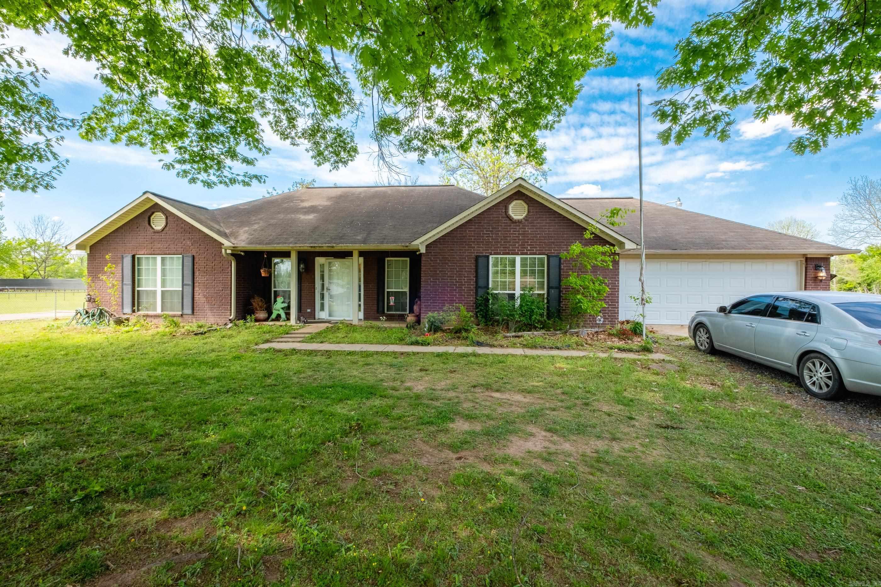 1 owner home sitting on 1/2 acre with a 30x30 workshop in the back with electricity. Home has 3 bedrooms and 2 baths, the primary is separate from the other 2 bedrooms. A large eat in kitchen area, a nice size laundry room with room for an extra fridge and extra storage also.  The old river is just across the road for great fishing and boating with beautiful sunrises and sunsets. Schedule your appointment today.