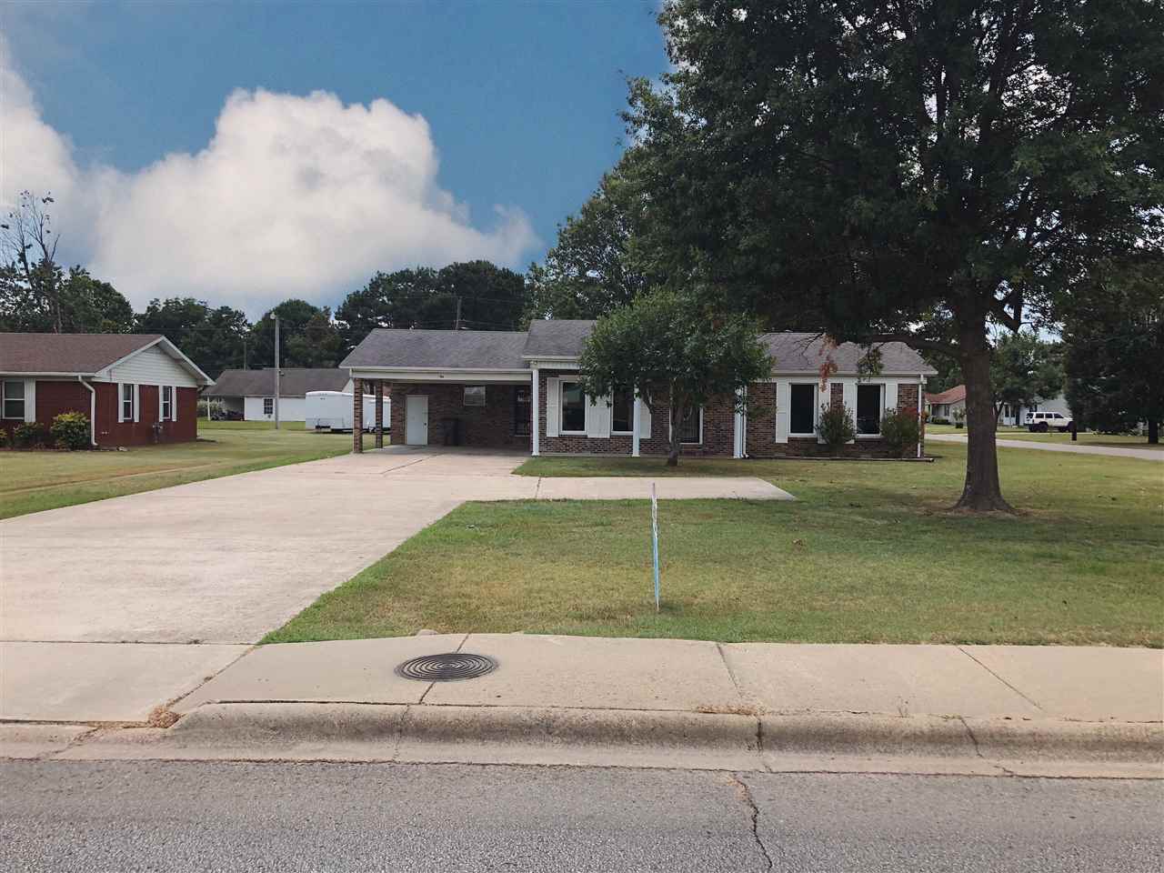 CLASSIC CURB APPEAL!  SUPER NICE BRICK HOME ON LARGE CORNER LOT!  3/2 1465 SQFT+/- W FIRE PLACE.  PRICED BELOW $133,000 APPRAISAL!
