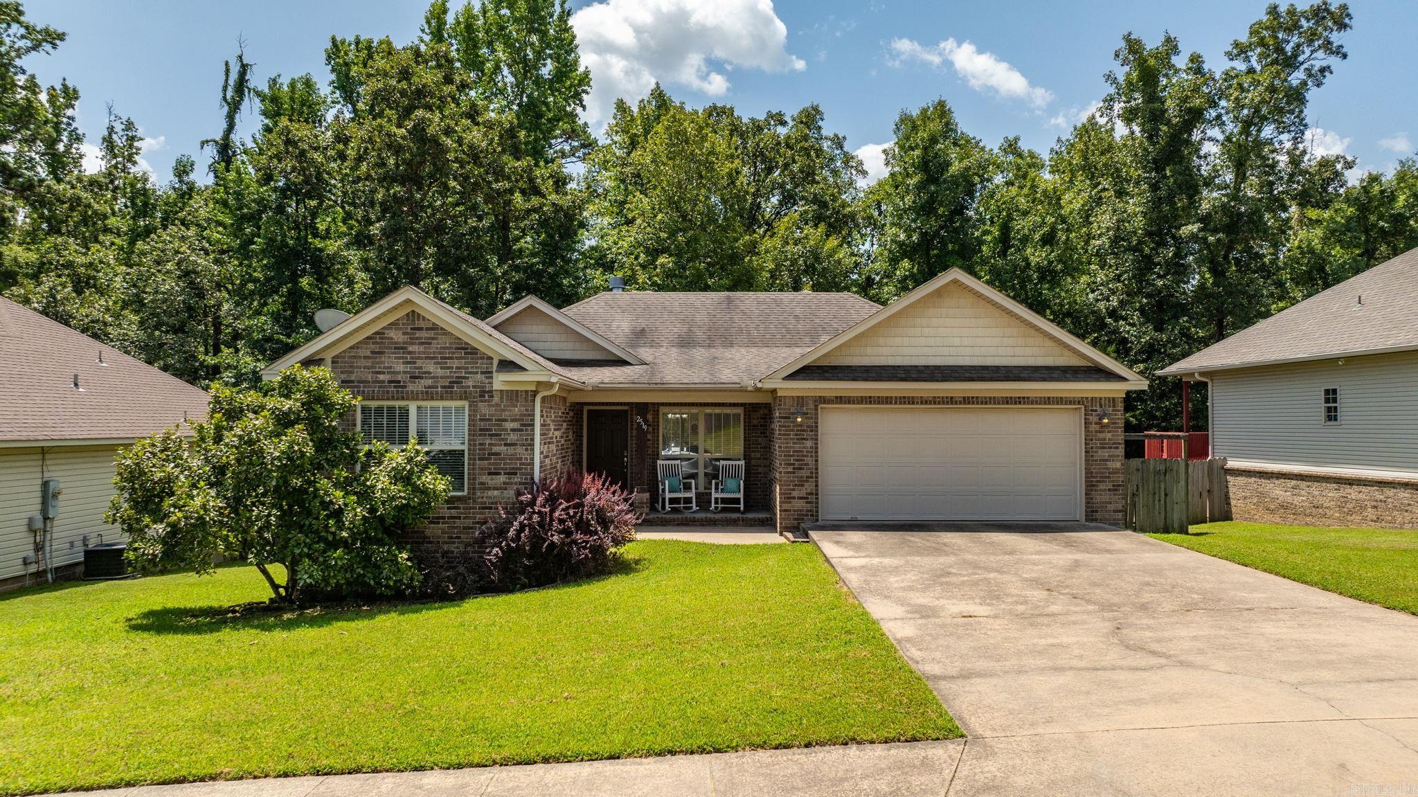 Welcome to 2519 Springhill Village Dr! This beautiful 3-bedroom, 2-bath home offers a well-designed one-level floor plan with 1,412 square feet of living space. The home features an inviting kitchen with a breakfast bar, a spacious dining area, a two-car garage, and a fully fenced backyard with a new deck—perfect for relaxing or entertaining. Located just a few houses down from the neighborhood playground, this home is conveniently situated in Springhill Village with easy access to shopping, dining, schools, and other Bryant amenities. Schedule today!
