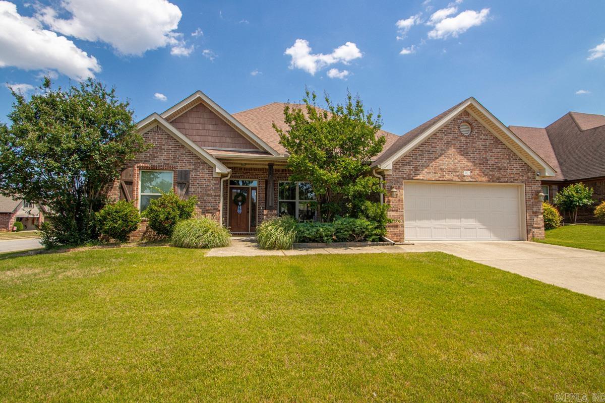 Beautiful 4-bedroom, 2-bath all-brick home situated on a desirable corner lot in a newer subdivision. The spacious primary suite features three walk-in closets, a relaxing jetted tub, and a separate walk-in shower. The kitchen is equipped with granite countertops and stainless steel appliances, perfect for both everyday living and entertaining. Enjoy the warmth of hardwood floors in the living room, complete with a cozy gas fireplace. Step outside to a covered back patio overlooking a large, fully fenced backyard with both a double gate and a walk-in gate for added convenience. Ample storage is available throughout the home with generous closet space.