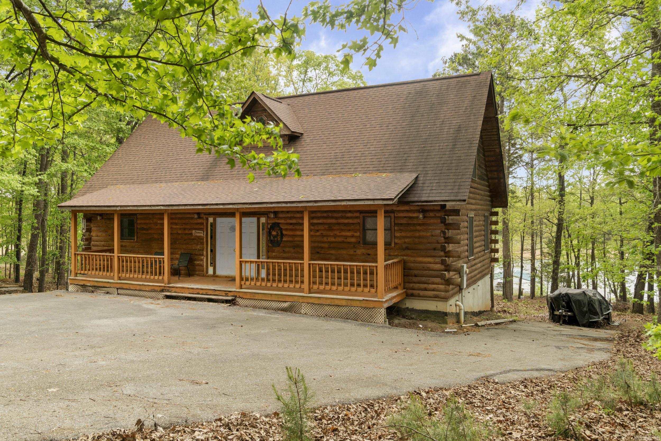 Experience the best of waterfront living in this spacious 3-bedroom, 3-bath lakefront home offering 2348 square feet of finished living space plus 1216 square feet of unfinished walkout basement ready for your vision. Comes with a private 2 boat slip, this property is ideal as a full-time residence, vacation home, or income-producing investment. The main level features an open-concept layout filled with natural light and highlighted by beautiful lake views. The kitchen flows seamlessly into the living and dining areas, creating an inviting space for entertaining family and friends.  The primary suite provides a relaxing retreat along with it's own bath, while two additional bedrooms each have full baths ensure comfort and privacy. The unfinished basement presents incredible potential, perfect for adding additional bedrooms, a media room, gym, or expanding living space to suit your needs. Step outside to a spacious deck overlooking the lake, ideal for morning coffee, sunset views, and outdoor entertaining. Enjoy direct access to boating, fishing and all the water activities. Make this excellent property yours, come and see for yourself.