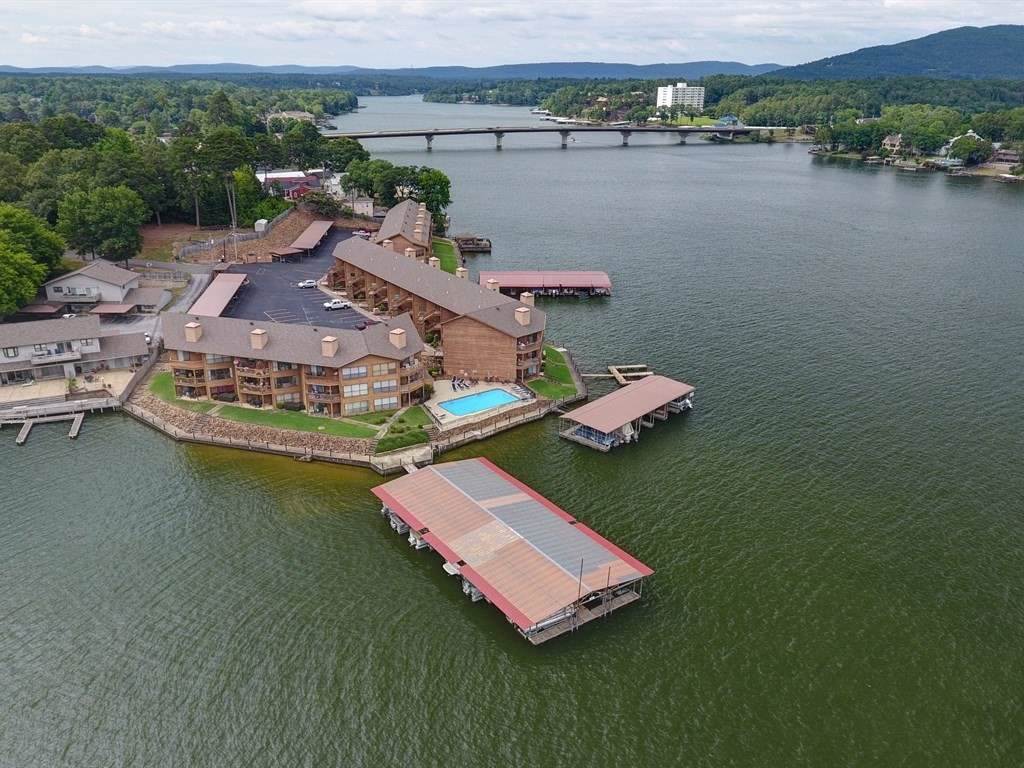 Lake Living with Main Channel Views!!! This Lake condo complete with Covered Boat dock, Covered Parking, Pool, Gated and Priced to Sell! Beautiful Gated community with Picnic Pavilion for all to enjoy! Great Room with Great views, Beautiful view from master that features walk in closet and full bath. This 2 bedroom 2 bath won't last long, Make appointment today!!