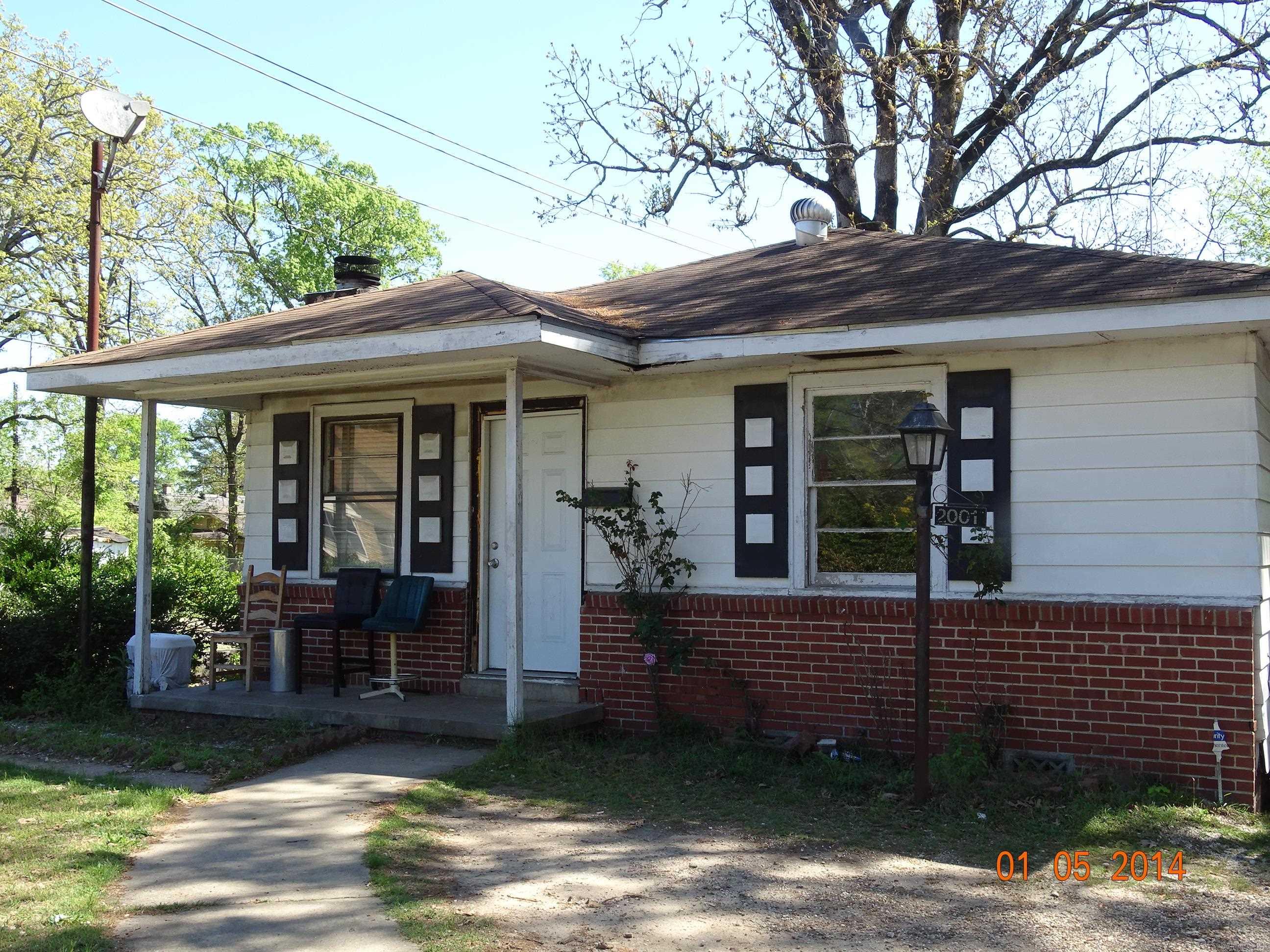 check this out!! This home is on a corner fenced lot.  It features a large living/dining room area with a fireplace.  Tenant occupied.  Need 24 hour notice.  Sold as is.