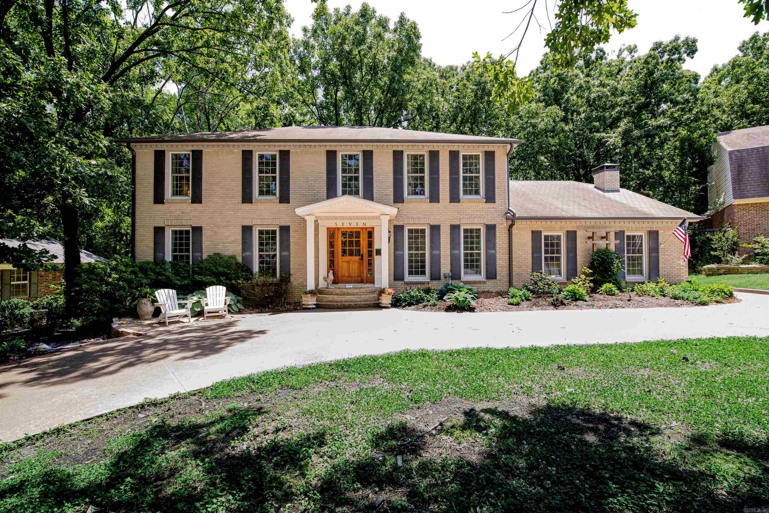 New updates!  While preserving its timeless architectural character, this distinctive 4-bedroom, 2.5-bath Pleasant Valley home is tucked away on a quiet, low-traffic street and showcases soaring vaulted ceilings with exposed beams, wide-plank natural wood floors, abundant natural light, and a striking wood-burning stove that anchors the main living space. Recent improvements throughout the home create an experience while maintaining the warmth and craftsmanship that make this home unique.  The flexible floor plan offers multiple living and entertaining spaces, including a dedicated office, inviting sunroom, spacious bedrooms, and comfortable gathering areas designed for everyday living. Outside, the circular drive enhances the home’s exceptional curb appeal, while the private backyard backs to peaceful green space. A detached workshop adds valuable space for hobbies, storage, or projects, a rare feature adding to the home’s versatility.   Combining architectural charm, thoughtful updates, flexible living space, and a sought-after Pleasant Valley location, 7 Chaparral Lane offers a rare opportunity to own a home with both character and functionality.
