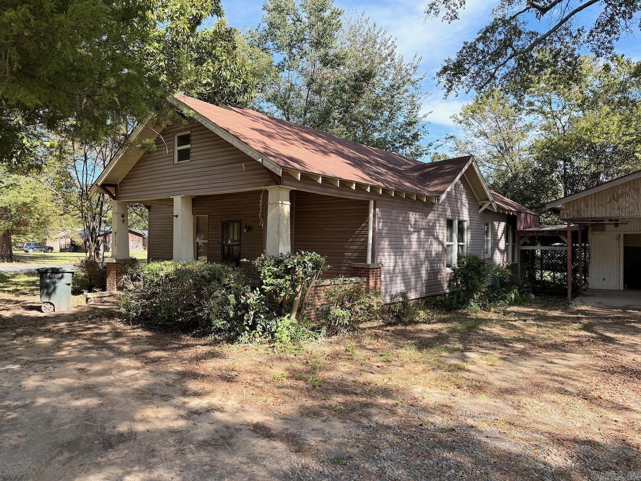 2 bedroom 2 bathroom craftsman style home on a corner lot in the heart of Monticello.  New shingles on a gable roof with exposed rafters, new flooring throughout with upgraded sub flooring.  Full width front porch to enjoy the shaded yard.  Detached carport and workshop with plenty of parking. Cash flow opportunity in a rental market that's low on supply or great for a family looking to own their own home.