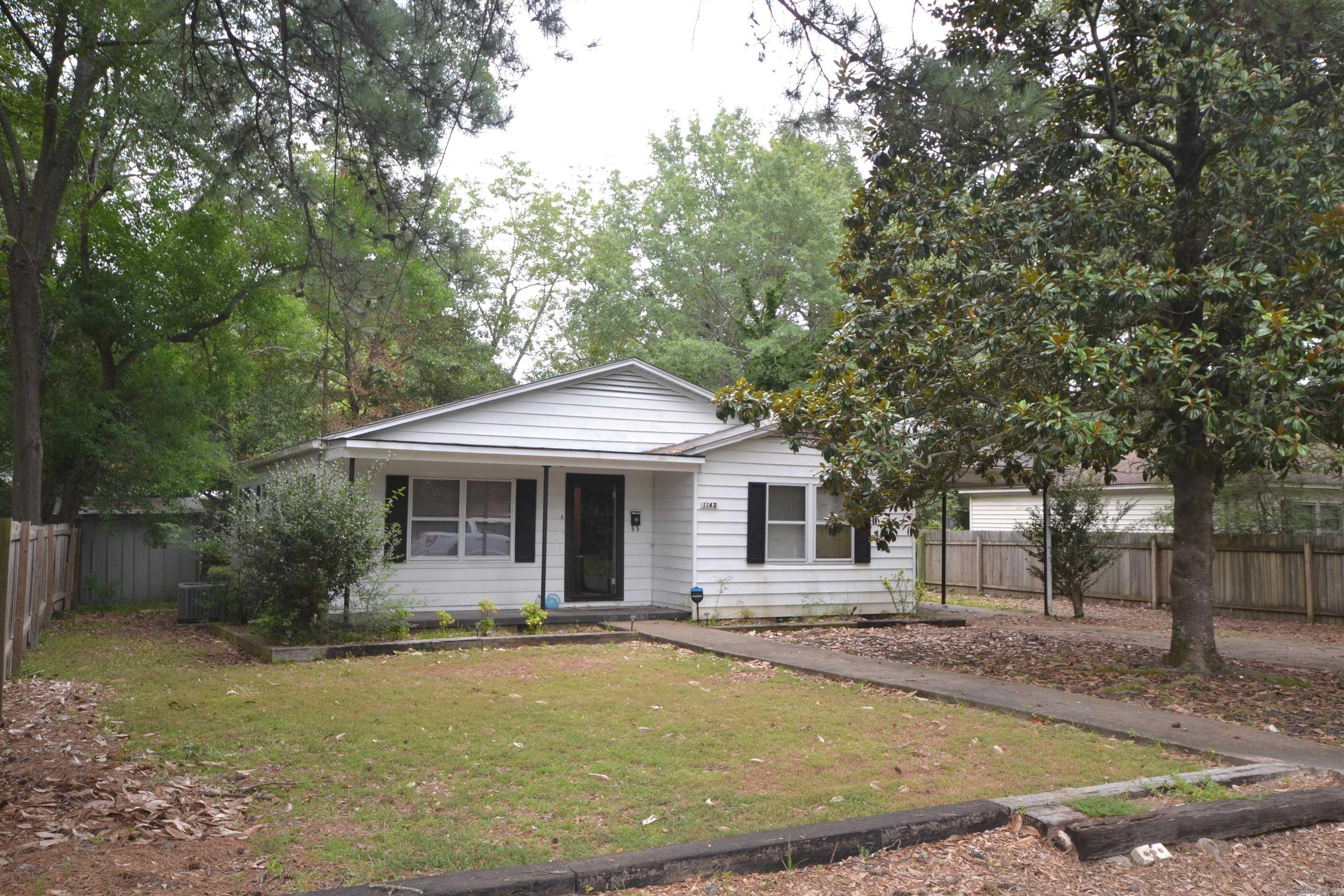 This two bedroom, two bathroom home is located close to schools and has wood floors throughout. Outside features a fenced in backyard and storage building. Roof is less than two years old.  Square footage is per county tax records. If exact square footage is desired, please have independently measured.