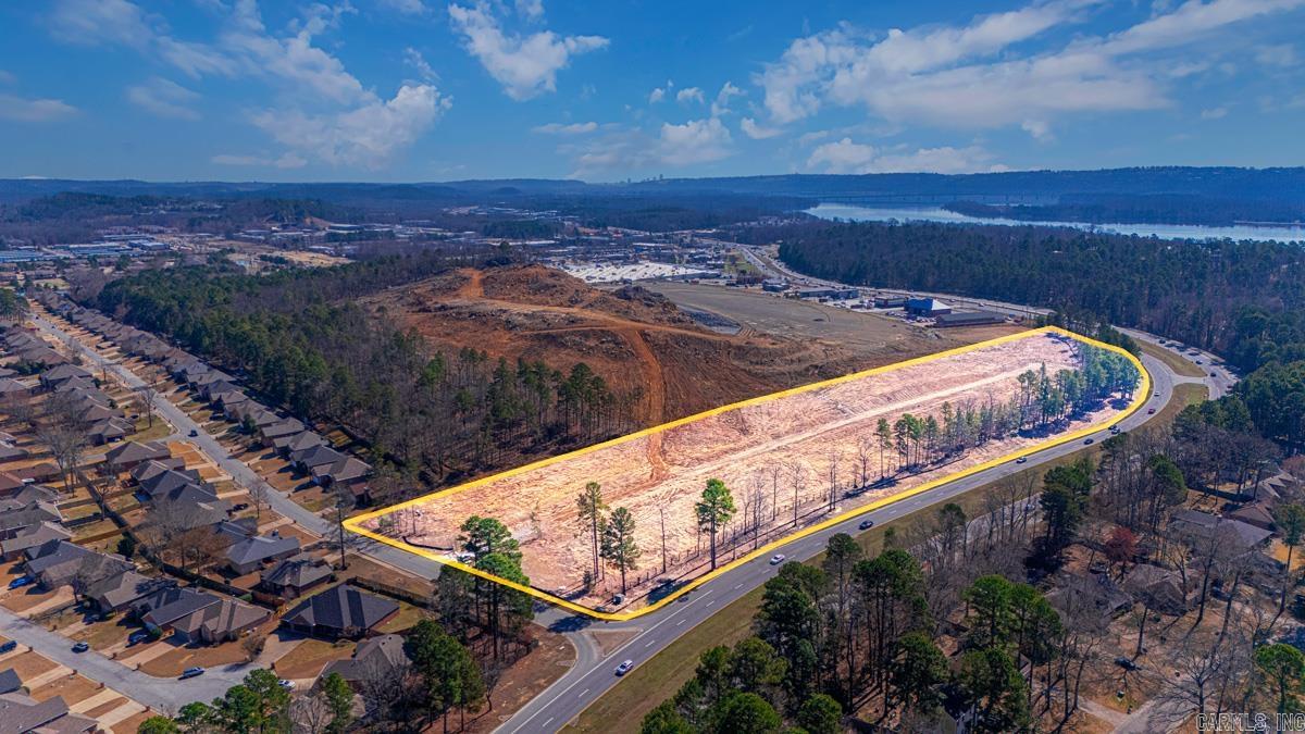 Prime ±8.1 acre commercial development site located on Maumelle Blvd (Hwy 100) in Maumelle. The property offers outstanding visibility and exposure with approximately 32,000 vehicles per day along this major retail corridor.   Zoned PDC (Planned Commercial Development) with utilities available including electric, water, sewer, and natural gas.   The site is surrounded by established residential neighborhoods and existing retail development and benefits from strong demographics including 44,501 residents within a 5-mile radius and median household income of approximately $74,000 within a 10-minute drive.  Preliminary plans indicate the potential for multiple commercial pad sites, making this property ideal for retail, restaurant, medical, or service development.