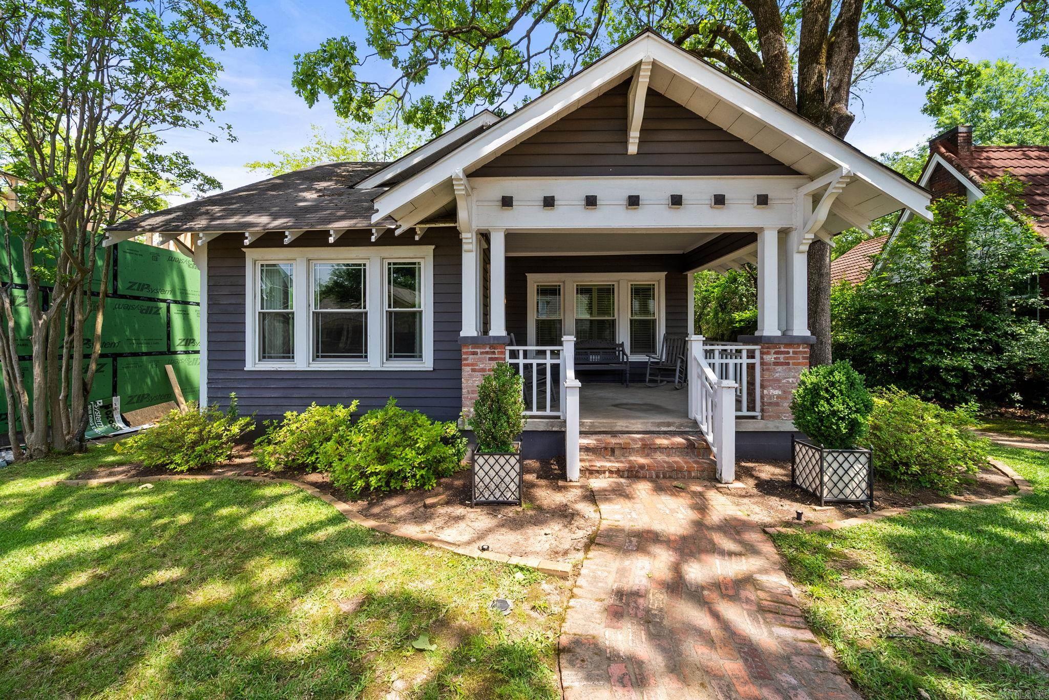 One of the most charming homes in the HEIGHTS! Inviting front porch, fabulous architecture and wonderful floor plan with numerous modern updates! Handsome hardwoods and pretty decor. Spacious sunny living room. Large dining area. Updated kitchen with breakfast area and wonderful den. Fantastic primary suite and a full guest suite on the main.  Upstairs: fantastic guest suite with bath. Excellent location in the heart of the Heights easy walking distance to shops and fine dining. Perfect back yard for family cookouts and outdoor entertaining. Storage and rear loading garage.