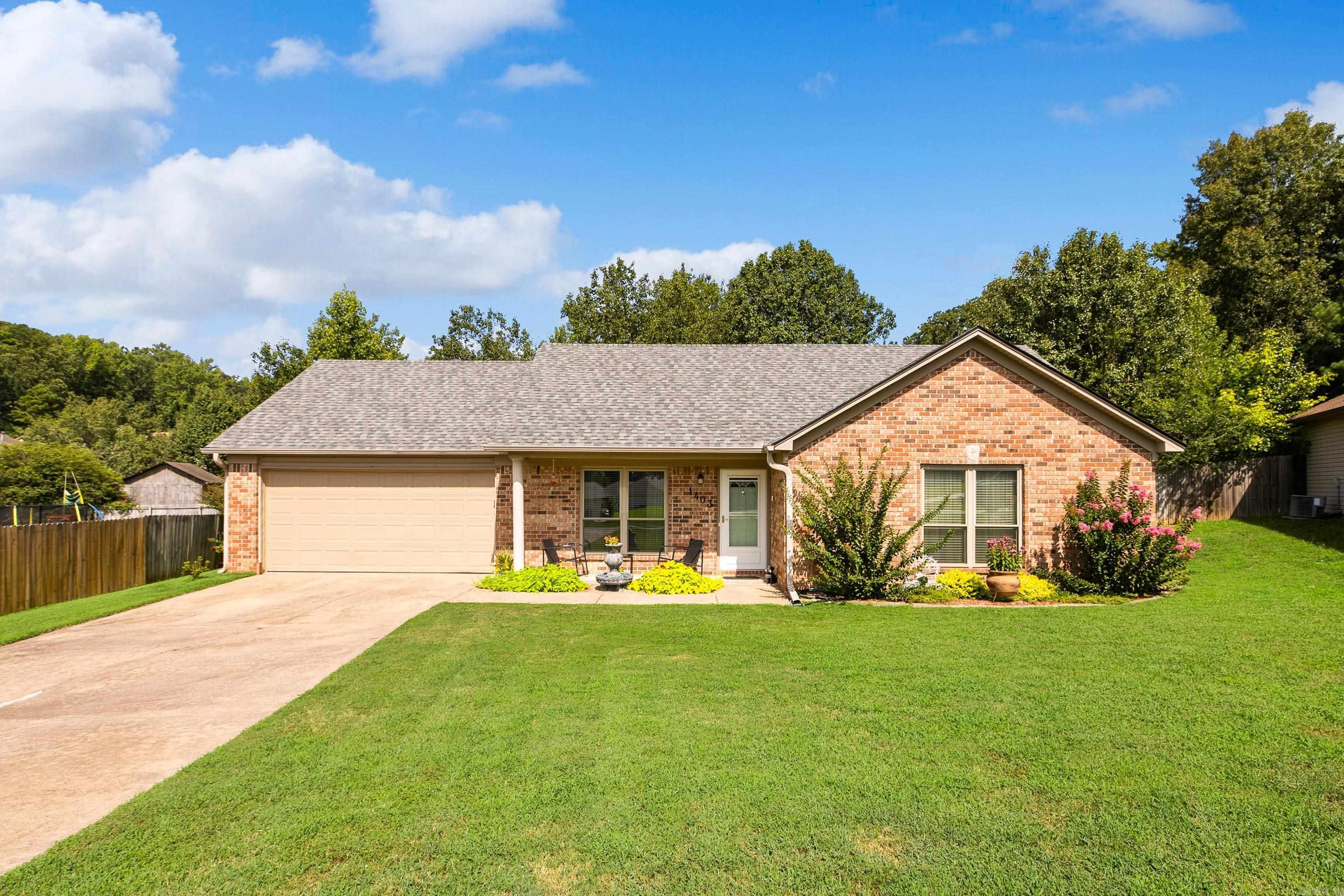Welcome to 1403 Overlook Cove in Benton! If you've been searching for an updated, move-in ready home at an affordable price, this is one you won't want to miss. It's becoming harder and harder to find a home with this many updates for under $200,000!  This beautifully refreshed home features a NEW ROOF, fresh interior paint, new carpet, updated front windows, new granite countertops in the kitchen, and completely remodeled bathrooms,  with modern finishes. Every update has been thoughtfully completed, making this home truly move-in ready.  Outside, you'll find a spacious, fully fenced backyard with plenty of room for kids, pets, gardening, or entertaining family and friends.  Conveniently located near schools, shopping, restaurants, and all that Benton has to offer, this home combines value, comfort, and location. Don't miss your opportunity to own an updated home with all these features at an exceptional price! Make an appointment to view today!