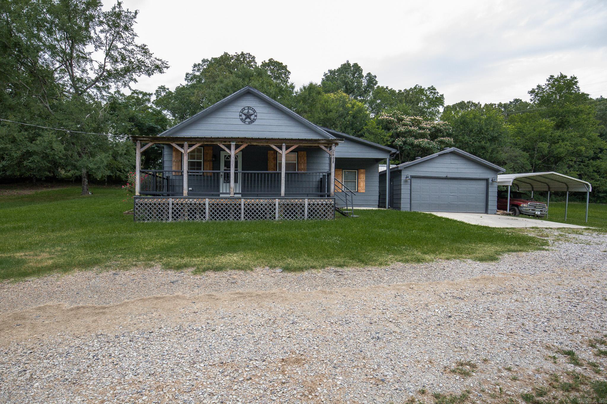 Escape the hustle and enjoy the peaceful charm of country living less than 2 miles from Lake Hamilton! This 3 bed 2 bath home sits on an acre of land with a 10x10 shed that is insulated with electricity perfect for hobbies! 2 car garage and a large carport! Updates include all brand new flooring, an updated master bath, a forever porch, gutters 2024, roof 2024, HVAC 2021, and hot water heater 2022 offering peace of mind for years to come. Property qualifies for $0 down USDA loan. Schedule your showing today!