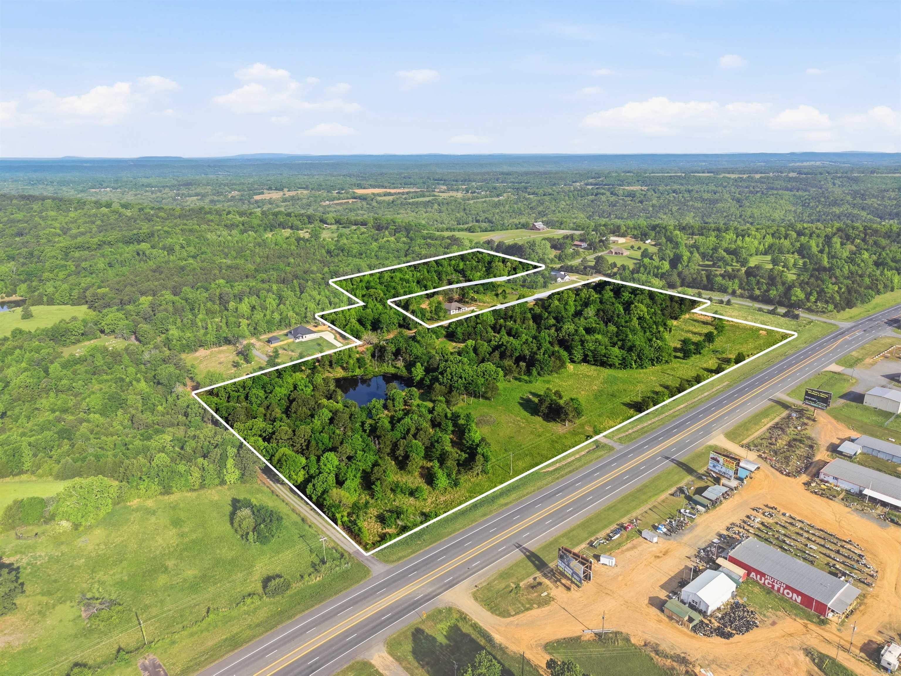Developers and investors take a look! Two parcels being sold as one deal! Approximately 1,339 ft of Highway 65 frontage. Don't need all the acreage? We're open to subdividing. Pursue a commercial development upfront by Highway 65 or build homes on the back lots. 3 have already been built on Heritage Ln. Let's get some more built! Pioneer Ln is available to build on as well. Hillbrook Farms Wedding Venue is just around the corner. Water, and electricity on site (underground utilities). A gas line runs along Solomon Grove Rd. Petit Jean Electric, Damascus Water, Summit Gas. Great potential for a commercial pursuit or residential development! Fantastic location just 7 minutes from Greenbrier and 24 mins from Conway, ensuring a wide arrange of amenities within a short drive. Parcel #778-10989-000 (25 Acres) and Parcel #778-10989-002 (4 Acres). Tax data for larger parcel only.