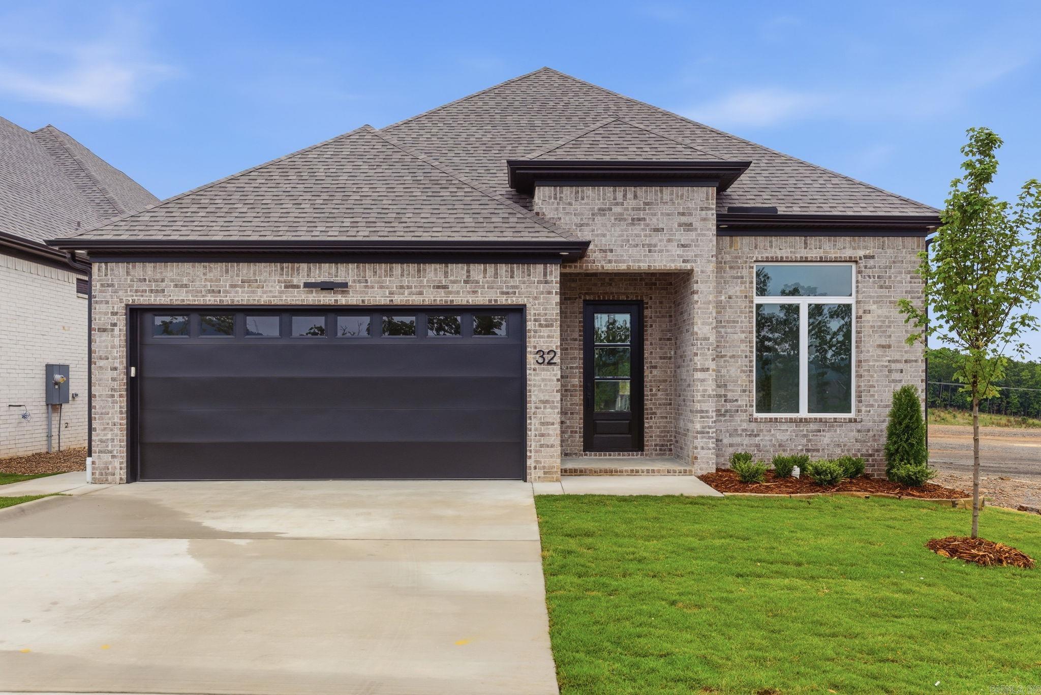 Discover Mountain Brook, West Little Rock’s newest neighborhood, ideally situated off Highway 10 behind The Ranch. This single-level Ranch home blends quality craftsmanship with modern style, offering three bedrooms and two bathrooms with a formal dining space. The primary suite is a true retreat, featuring bath with a soaking tub, walk-in shower, and a custom-designed closet. The living room impresses with soaring 12-foot ceilings with fireplace. At the center of the home, the chef’s kitchen showcases quartz countertops, custom cabinetry, dining area with coffee bar, and a corner pantry—perfect for both everyday living and entertaining. Step outside to enjoy relaxing evenings by the outdoor fireplace. Contact the listing agent today to schedule your private tour..