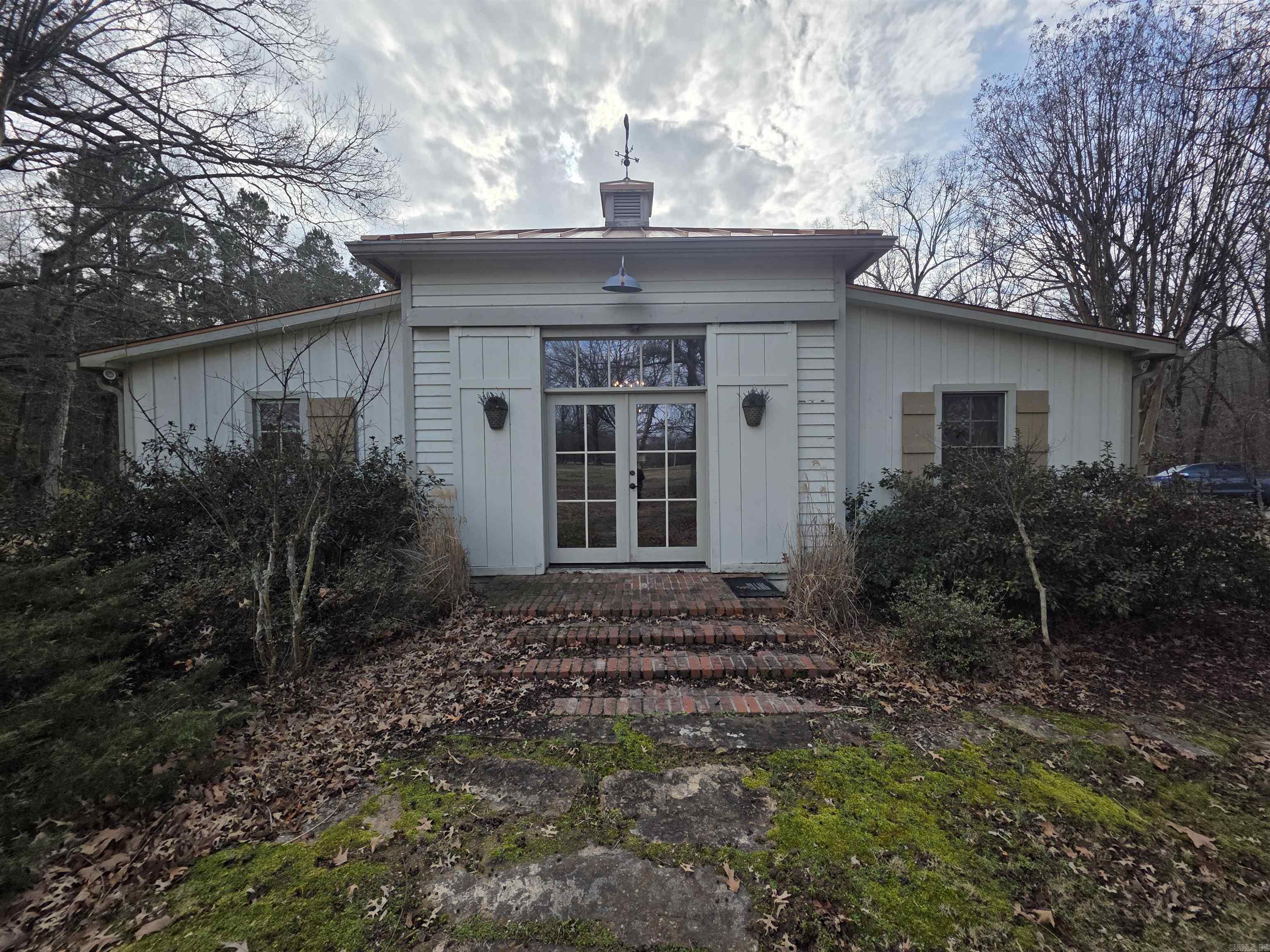 If you are looking for a beautifully unique home in a country setting, this is the one! It features a custom built main house of 1520 Sq Ft having beautiful tongue and groove wood throughout with large overhead beams in the open concept living/kitchen area.  Both bedrooms have a large adjoining bathroom. One having a spacious walk in shower with multiple shower heads and the other having a beautiful claw foot tub.  It sits on 10 mostly cleared acres with lots of wildlife around. The 21x24 heated and cooled bonus room located off the back deck is perfect for hanging out or entertaining by the fireplace.  Come on home! You know you want it!