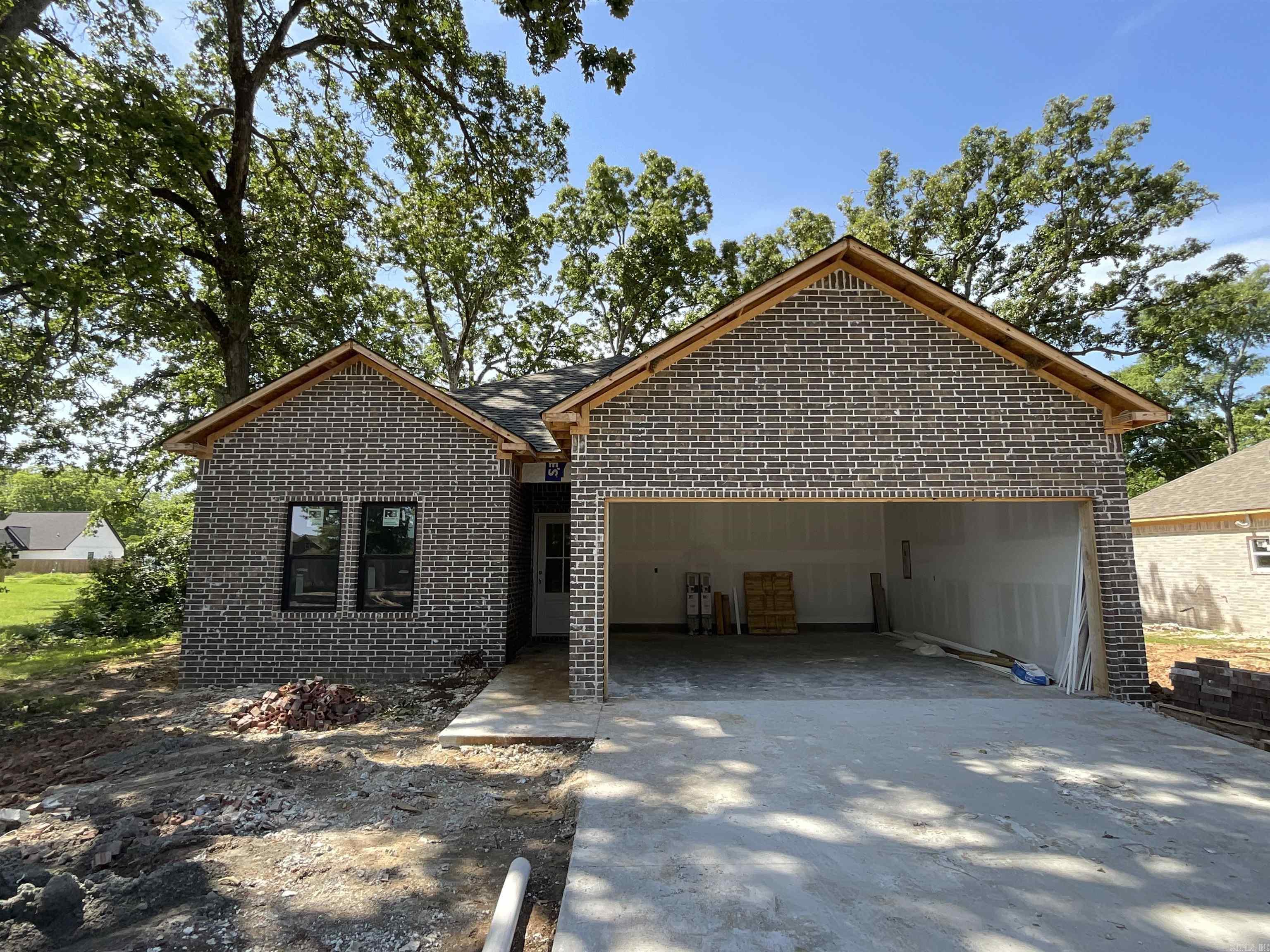 Lonoke is getting some wonderful new additions to this beautiful neighborhood! Super convenient access to I-40 makes this a tucked-away gem! All-brick exterior opens to an open concept living space! You will find all these rooms "just right" in size, including the high ceilings in living room and primary bedroom! Drywall is going up this week, so more pictures and floorplan map will be coming soon!