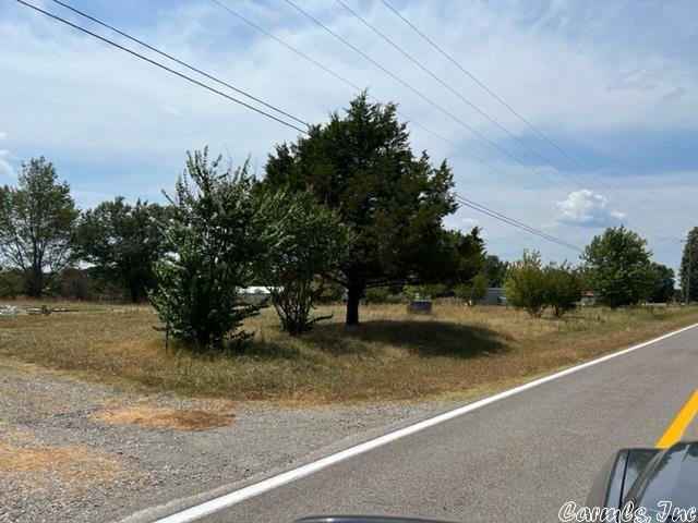 Quiet 1 acre lot backing up to a hay field. Lined with crepe myrtles and maple trees, this 1 acre lot will make a beautiful home site. Well, septic and electric on-site. 10 minutes to Bald Knob and 5 minutes to Pleasant Plains.