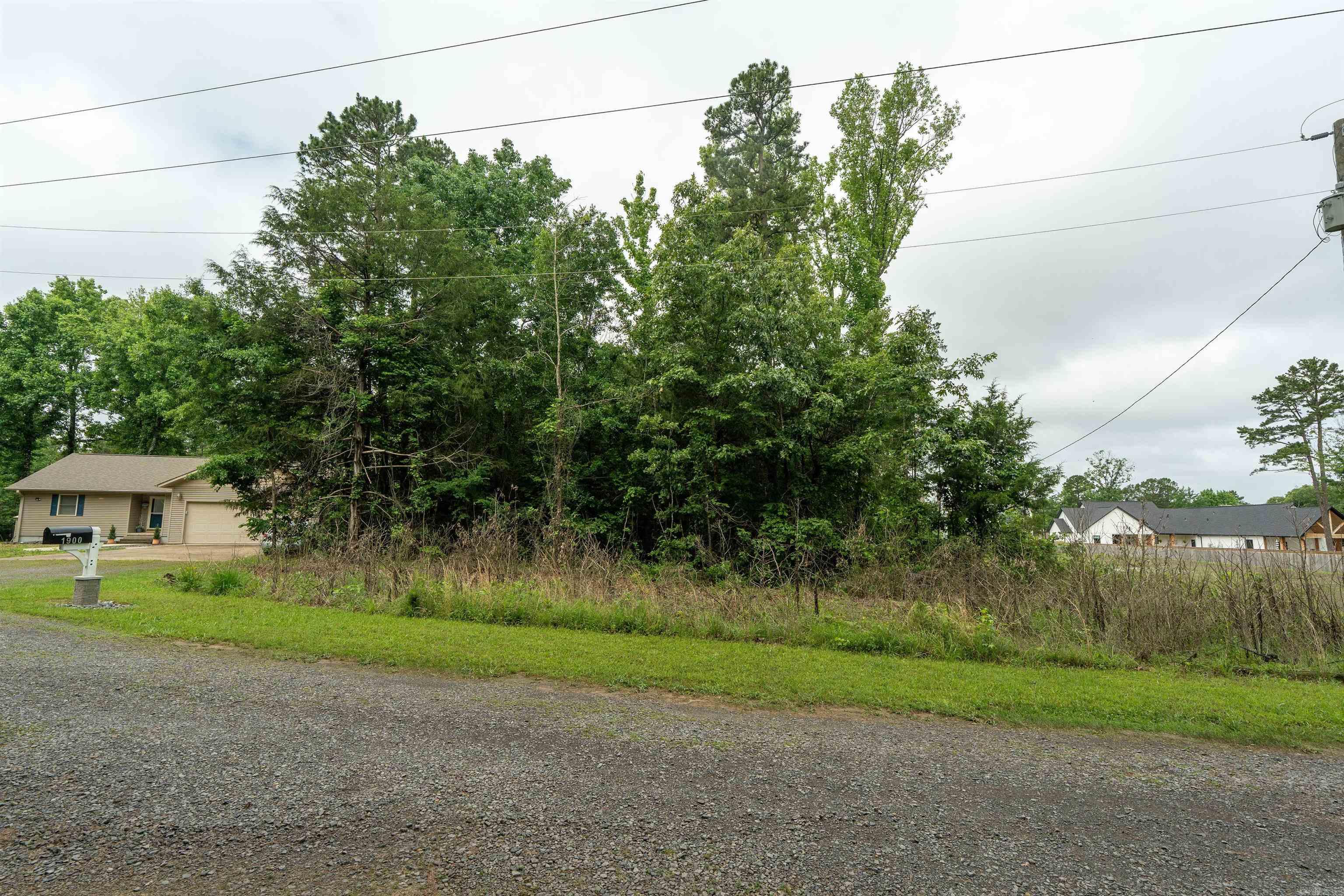 Wooded lot located on a peaceful road offering privacy and a quiet setting. Conveniently located near the airport, Dam Site Marina, and Greers Ferry Lake recreation.