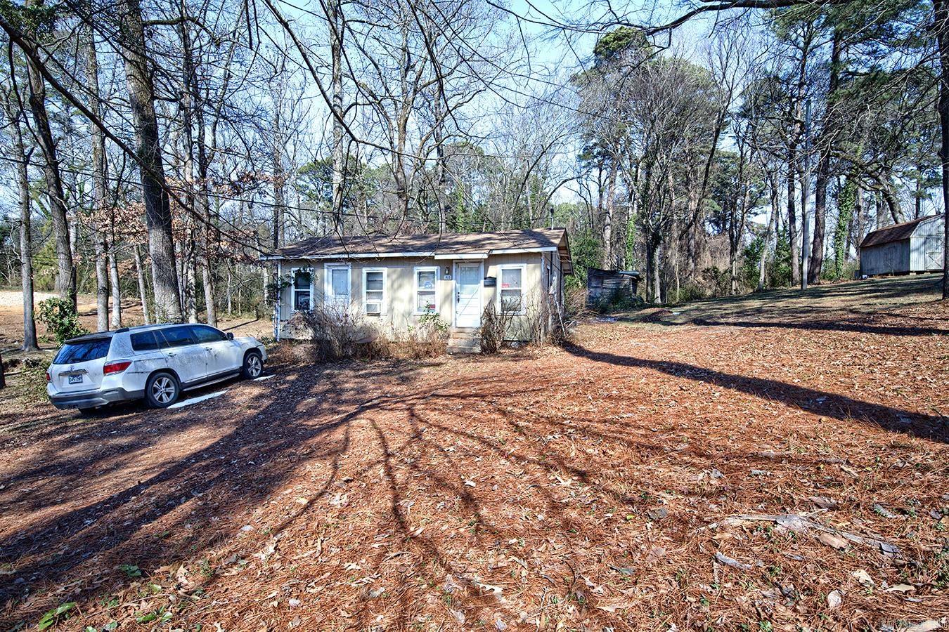 Exceptional opportunity to acquire an oversized lot in a highly desirable Benton location, just a short walk to Elementary through high school campuses.  This oversized parcel offers excellent potential for a custom build in an established area.  This property includes an existing structure that is uninhabitable marking this a true land-value offering.  Selling As-Is. No property disclosures.