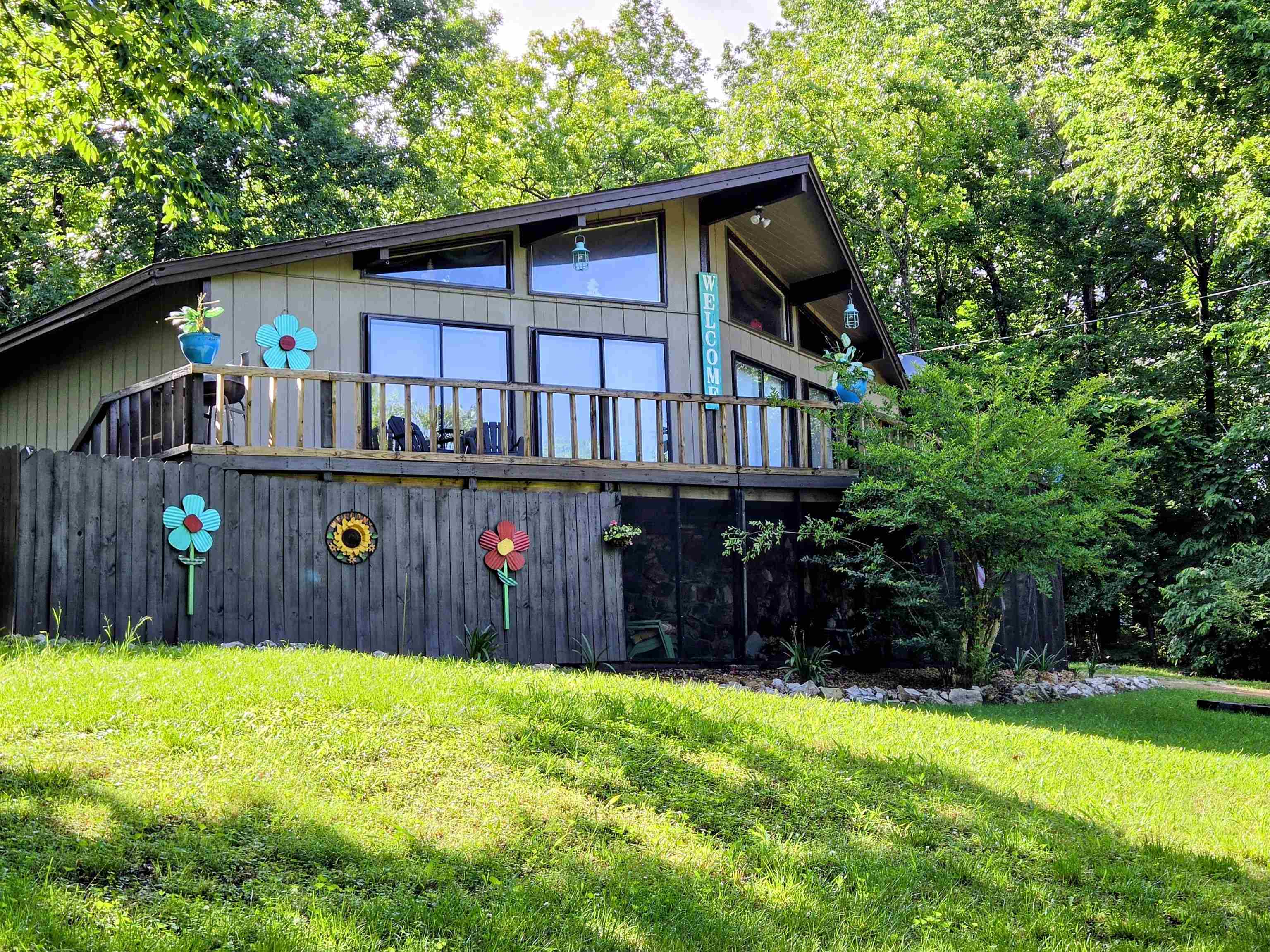 Lake Thunderbird Lake View home! Deck spans the front of the home so you can enjoy the view of the lake or the wildlife from the extra lot next door included. Inside there is plenty of natural light from all the windows and doors out to the deck. Wood ceilings in main part of the home and vaulted in the living room. Custom light fixtures in most rooms stay or make it your own. Split floor plan with 1 bedroom and bath on one side with 2 others and 2nd bath on the other. Sliding glass doors from 2 front bedrooms and living room. Central heat updated in 2019 & gas back up heater avail if power goes out. Back deck leads to small fenced area for dogs plus cat door to catio off the laundry rm. Entry from the carport has tons of storage plus space available for freezer or even an office space. Kitchen includes 2 fridges (one blends right in with the cabinets), electric stove and breakfast bar for a quick bite. Updates include fresh paint inside and out, new laminate flooring, water heater, asphalt shingles 2024, new kitchen sink & bath vanities. 16X8 Bald Eagle Barn for all your outside toys. Screened in under the front deck to enjoy outside but not the bugs! Listed below appraisal price!