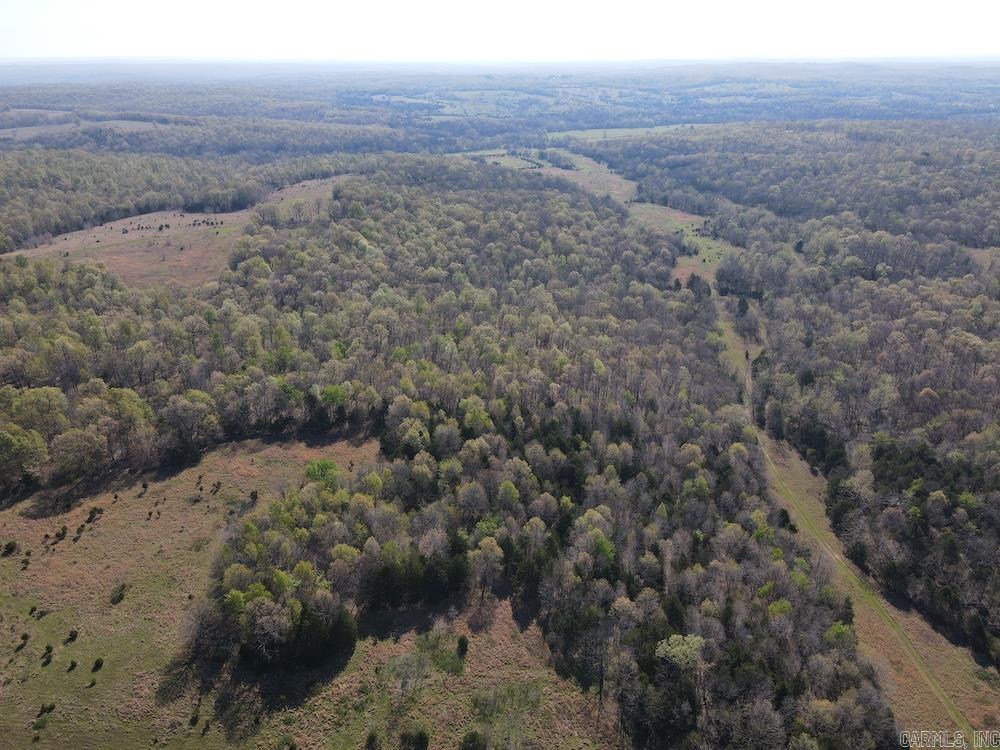 This 1,180± acre legacy ranch in Fulton County, Arkansas, has been expertly managed for over 30 years for both cattle production and premier hunting. Nearly half the property is in productive, rolling pasture, supported by excellent topography and two pipe cattle working corrals for efficient livestock operations. The ranch offers outstanding whitetail deer and turkey habitat, with mature hardwoods, established food plots, and a strong trail system for easy access. Water is abundant, featuring Camp Creek, a spring-fed creek, and multiple ponds, some stocked with fish. Recent prescribed burns have further enhanced habitat quality. With three access points and a county road dividing the property, it offers exceptional flexibility, including the option to purchase two separate tracts (approximately 587 and 593 acres). An older farmhouse with utilities adds immediate functionality. Located near the South Fork Spring River and close to Salem and Mammoth Spring, this versatile property is ideal for ranching, hunting, or both.