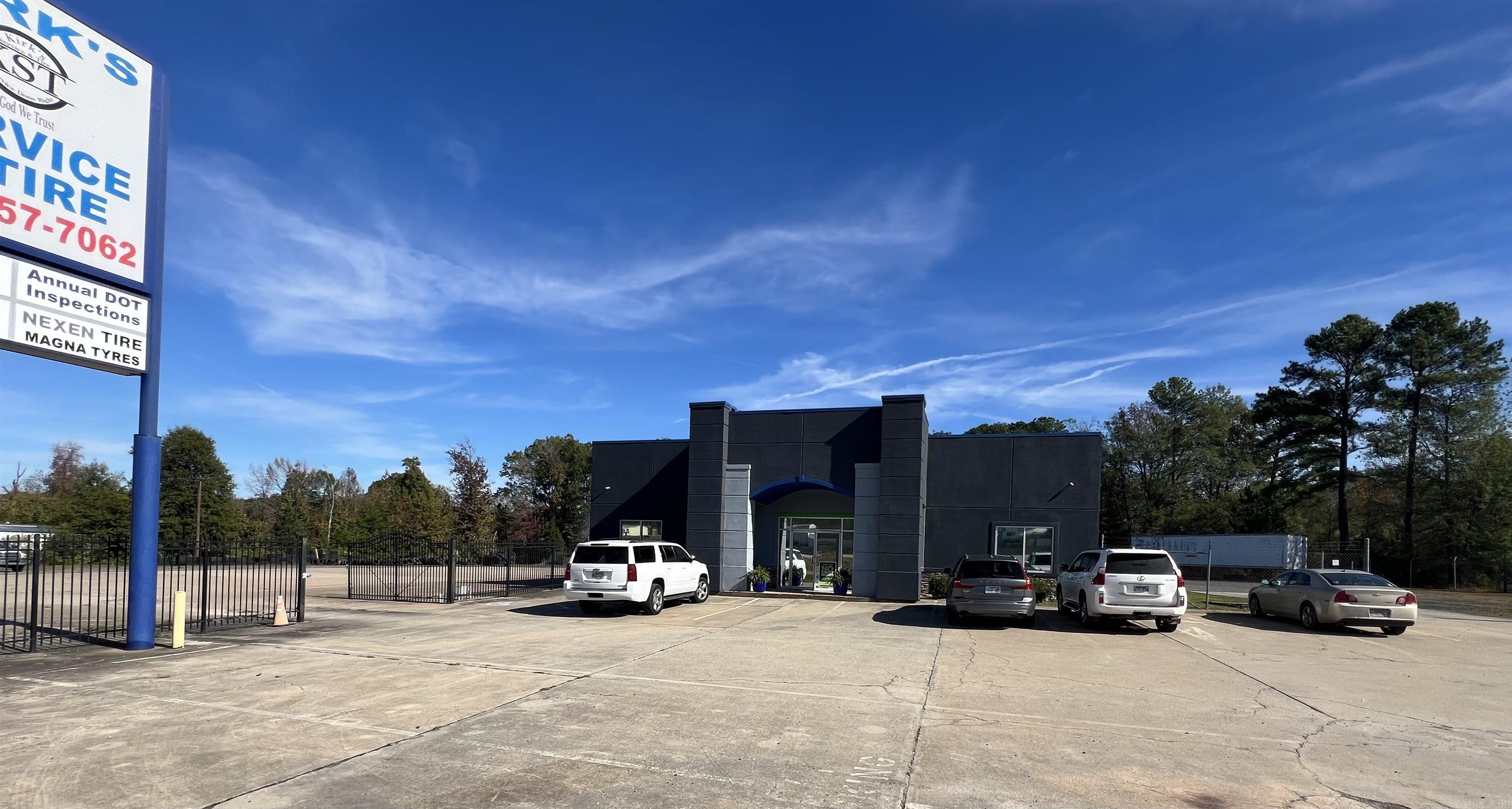 Fabulous location off Interstate 57/ US HWY 67/167. Endless Business Opportunities.  Beautiful stucco and stone storefront with large showroom and repair shop with 6 bay doors that can accomodate 18 wheeler service repair. 1200 sq ft Showroom boasts 2 executive offices, separate restrooms, storage area and new paint inside and out.  Repair shop has great lighting and plenty of storage for any business endeavor.  Excellent business visibility from Interstate 57, a large fenced concrete area and the beautifully updated building make this property a must see.