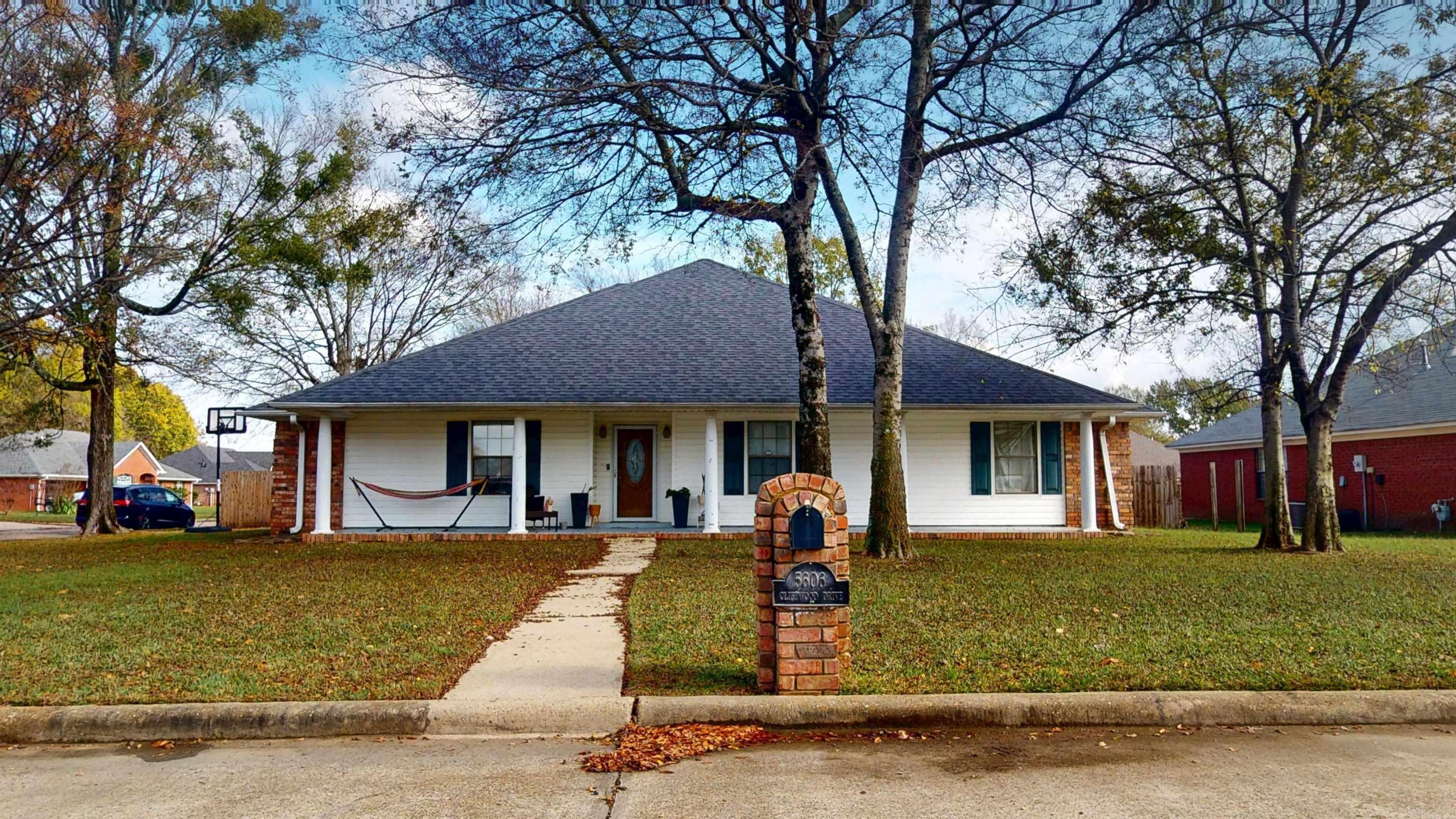 Welcome home to this cozy, but spacious, 3-bed, 2-bath home in the Texarkana, AR. In a neighborhood two minutes from I-30, this home offers convenient access to schools, dining, shopping, office centers, and all you need! The home feels peaceful and bright from the moment you walk in. The large living room welcomes the morning light and gives you plenty of room for family time in front of a nice fireplace. The floors are luxury vinyl plank (LVP), so they’re durable, clean, and perfect for real life. The whole house has been freshly painted, giving everything a bright, clean feel. In the kitchen, you’ll love the granite countertops.  The primary bedroom is roomy, with a walk-in closet and a private en-suite bathroom that has updated fixtures, a walk-in shower, and a big tub, perfect for relaxing after a long day. Both of the other bedrooms also have walk-in closets, so storage won’t be a problem. Step outside, and you’ll find a covered patio, great for sipping your morning coffee or hosting friends. The backyard is large, giving kids space to run or letting you dream of a garden. Off to the side, there's a 14×24 shop with power — big enough to store a vehicle, an ATV, or lawn gear.