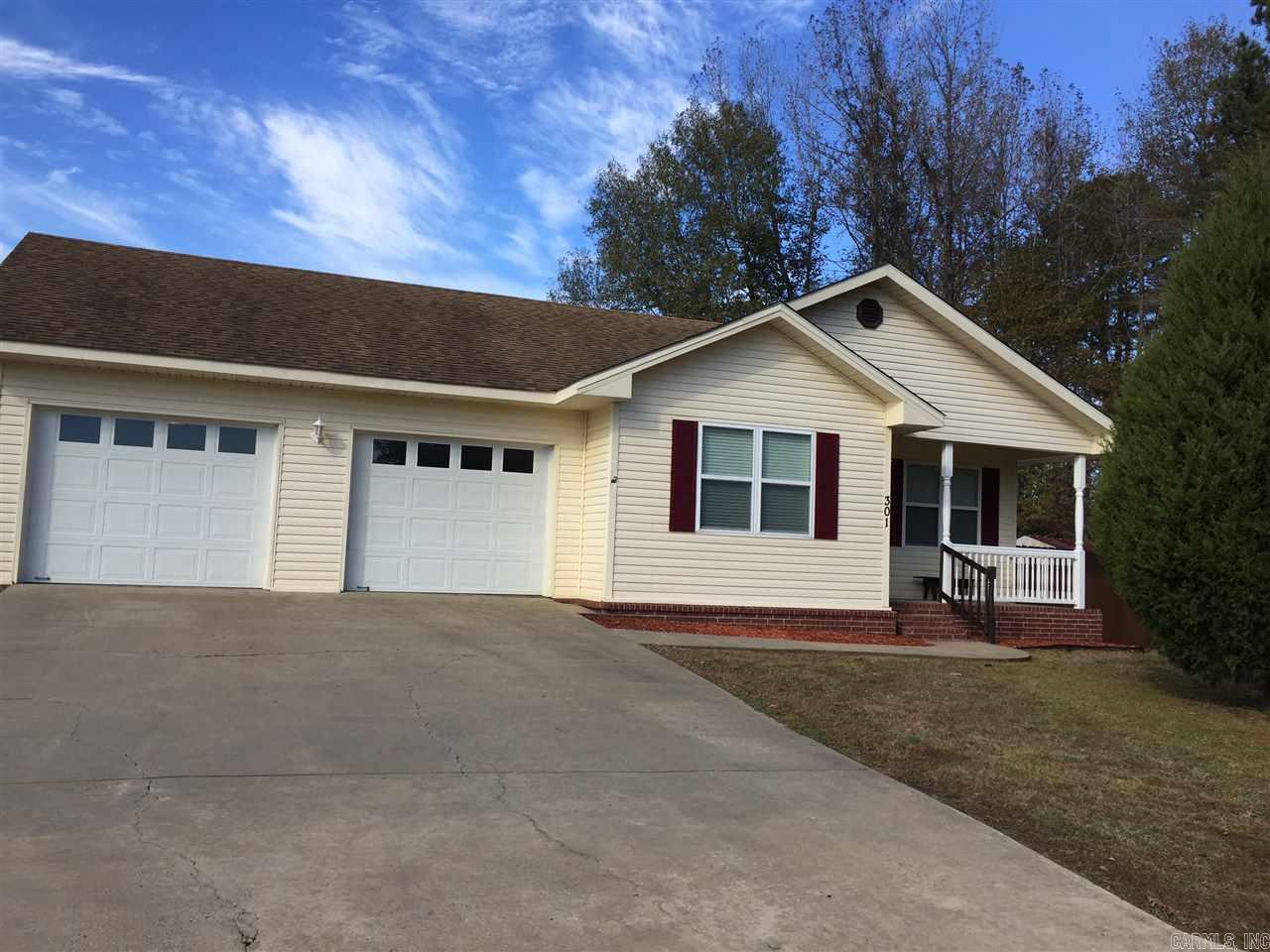 Living area open to the kitchen/dining room. New water heater, new stainless steel frig, microwave and dishwasher. new flooring and paint throughout. New vanities in both bathrooms, plus a double sink in master. Large fenced backyard w/deck.