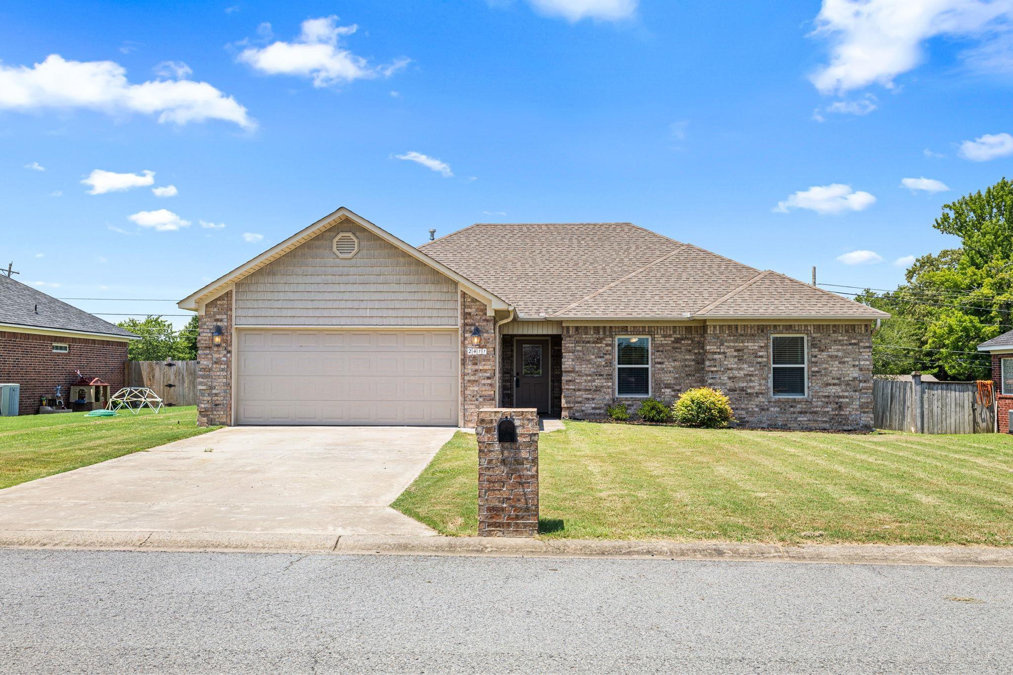 Welcome to 2411 Lancashire Drive, a move-in ready, all-brick home located in the highly desirable Cabot School District with an easy commute to Little Rock Air Force Base. The spacious living room is centered around a cozy corner gas log fireplace, creating the perfect place to relax after a long day. The oversized kitchen is a standout, offering an abundance of custom wood cabinetry, stainless steel appliances, and plenty of workspace for cooking, entertaining, or gathering with family and friends. The private primary suite includes a large bathroom with a wraparound vanity, triple mirrors, a jetted tub, separate shower, and generous space to start and end your day comfortably. Step outside to enjoy the fully fenced backyard, perfect for pets, gatherings or simply enjoying time outdoors. Whether you're looking for your first home, your next PCS destination, or simply more space in one of Cabot's most sought-after school districts, 2411 Lancashire Drive is ready to welcome you home. Some pics have been digitally staged.
