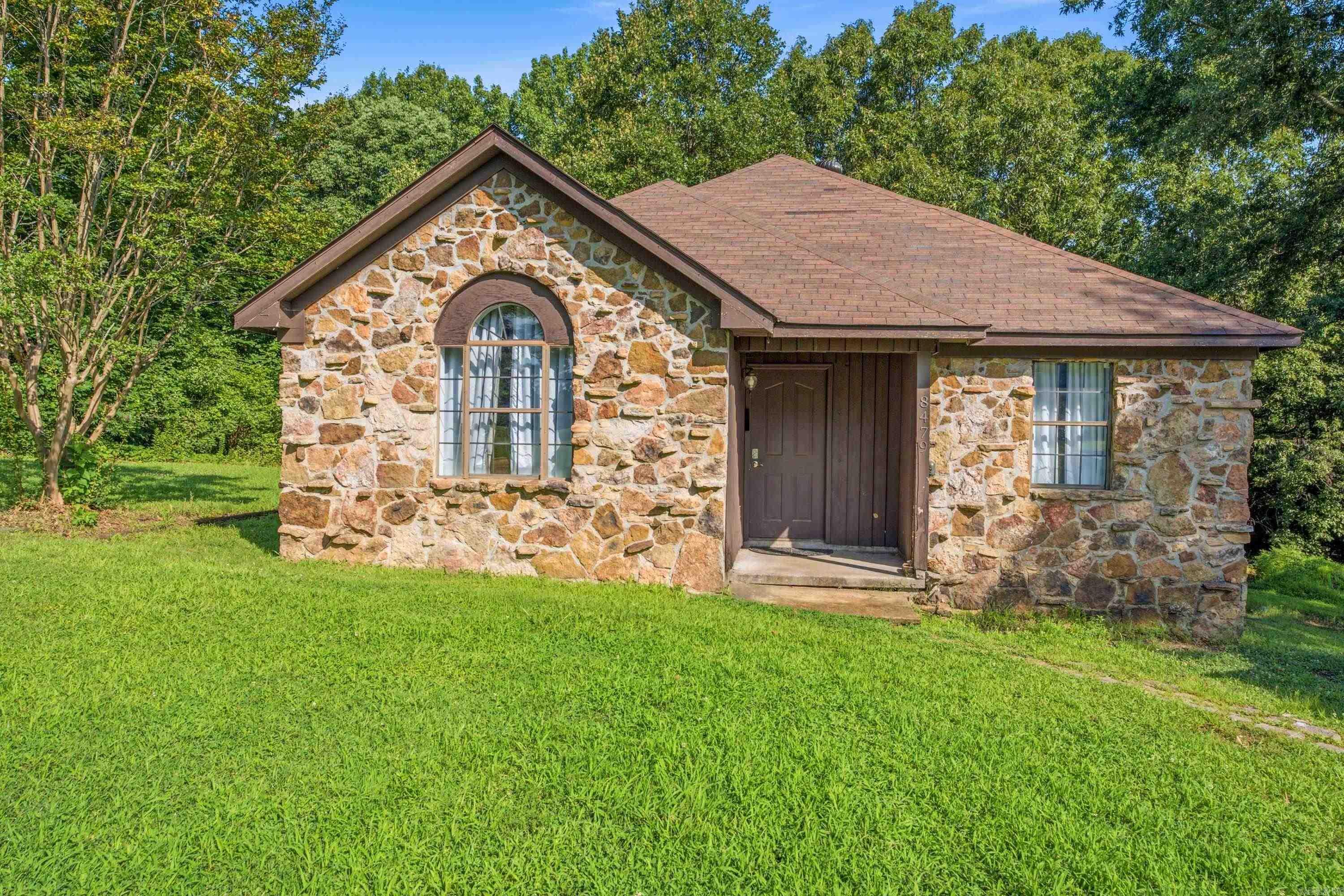 Welcome to 8479 Highway 163 in Harrisburg, Arkansas! Nestled on approximately one acre in a peaceful country setting, this 3 bedroom, 1.5 bath home offers the perfect opportunity for first time homebuyers, investors, or anyone looking to enjoy a little extra space. Inside, you'll find a functional layout with comfortable living areas, while outside features a spacious deck that's perfect for relaxing or entertaining. Need room for hobbies, storage, or a workshop? The large detached shop with an overhead door provides endless possibilities. Enjoy the tranquility of country living while still being just a short drive from town conveniences. Whether you're looking for your first home, an investment property, or a place to make your own, this property is full of potential. Don't miss your chance to see all it has to offer!