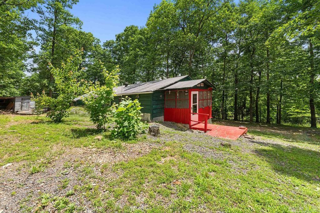 Escape to your own private retreat with this beautiful property offering approximately 11.80 acres of peaceful countryside. A year-round creek meanders through the land, creating a picturesque setting perfect for enjoying nature and abundant wildlife. The main home features a spacious screened-in porch where you can relax, entertain, or take in the tranquil surroundings. Tucked away in a private location, this property is ideal for hunting, recreation, or simply enjoying the quiet country lifestyle. Also included is a charming two-story guest home with 1 bedroom, 1 bathroom, and a small deck, providing additional space for guests, family, rental income, or a hunting cabin. Whether you’re looking for a full-time residence, weekend getaway, or recreational property, this unique acreage offers endless possibilities.