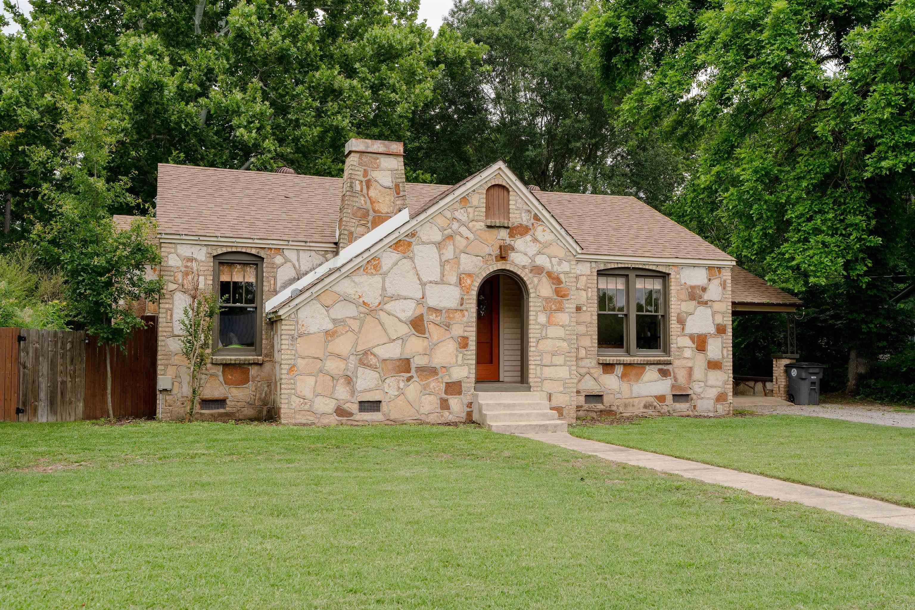 This beautifully updated 2 bedroom, 1 bathroom home features fresh paint, new flooring, gas log fireplace and refinished hardwood floors that add warmth and character throughout.The remodeled kitchen offers new cabinetry, stylish butcher block countertops and plenty of workspace for cooking and entertaining.  Outside, you'll find a spacious backyard perfect for relaxing or gathering with friends and family. Enjoy evenings around the firepit and take advantage of the additional storage building for tools, hobbies or outdoor equipment.  This move-in ready home combines modern updates with classic charm and plenty of outdoor space to enjoy and is only a mile to the Harding University Campus.