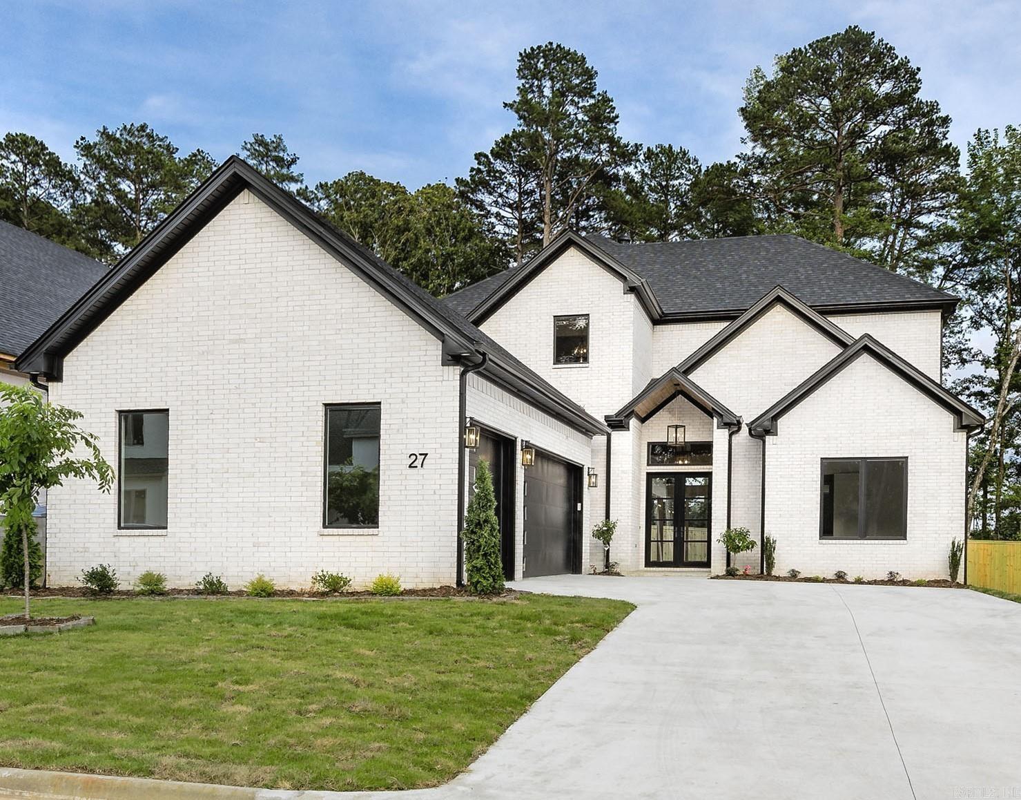 Beautiful new construction home built by JS Inspired Builders in Chenal Valley's newest gated community - MEREVILLE PLACE. This beautiful home has a level lot with great curb appeal and is only a short golf cart ride to the Chenal Country Club Founder’s Golf Course. Wonderful Floorplan. Luxury finishes throughout the home including Pella windows and doors, luxury quartz countertops, and hardwood floors throughout. The Chef's Kitchen has an oversized island, beautiful pendant lights, gas range, pot filler, undercounter ice maker, and double ovens. Off the kitchen is a butler’s pantry with wet bar and beverage cooler and a nearby walk-in pantry. The living area has 12’ ceilings, a beautiful contemporary fireplace with built in shelves. The living area opens to a large patio area with an outdoor fireplace. Upstairs is a large media/game room with another wet bar, beverage cooler, surround speakers and opens onto an upper balcony. There are High Efficiency HVAC/Furnace units, tankless hot water heater, and an EV Charger Outlet in Garage. Smart Sprinkler System. Eave Lights. Three Car Garage.