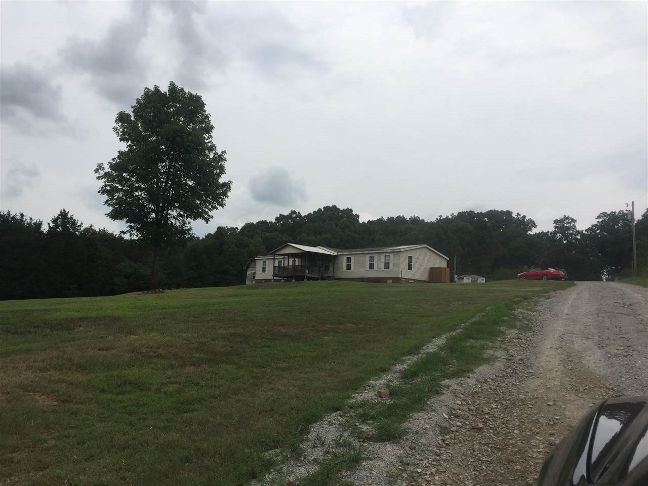 Beautiful setting with large home on the ridge, with three out buildings and large yard