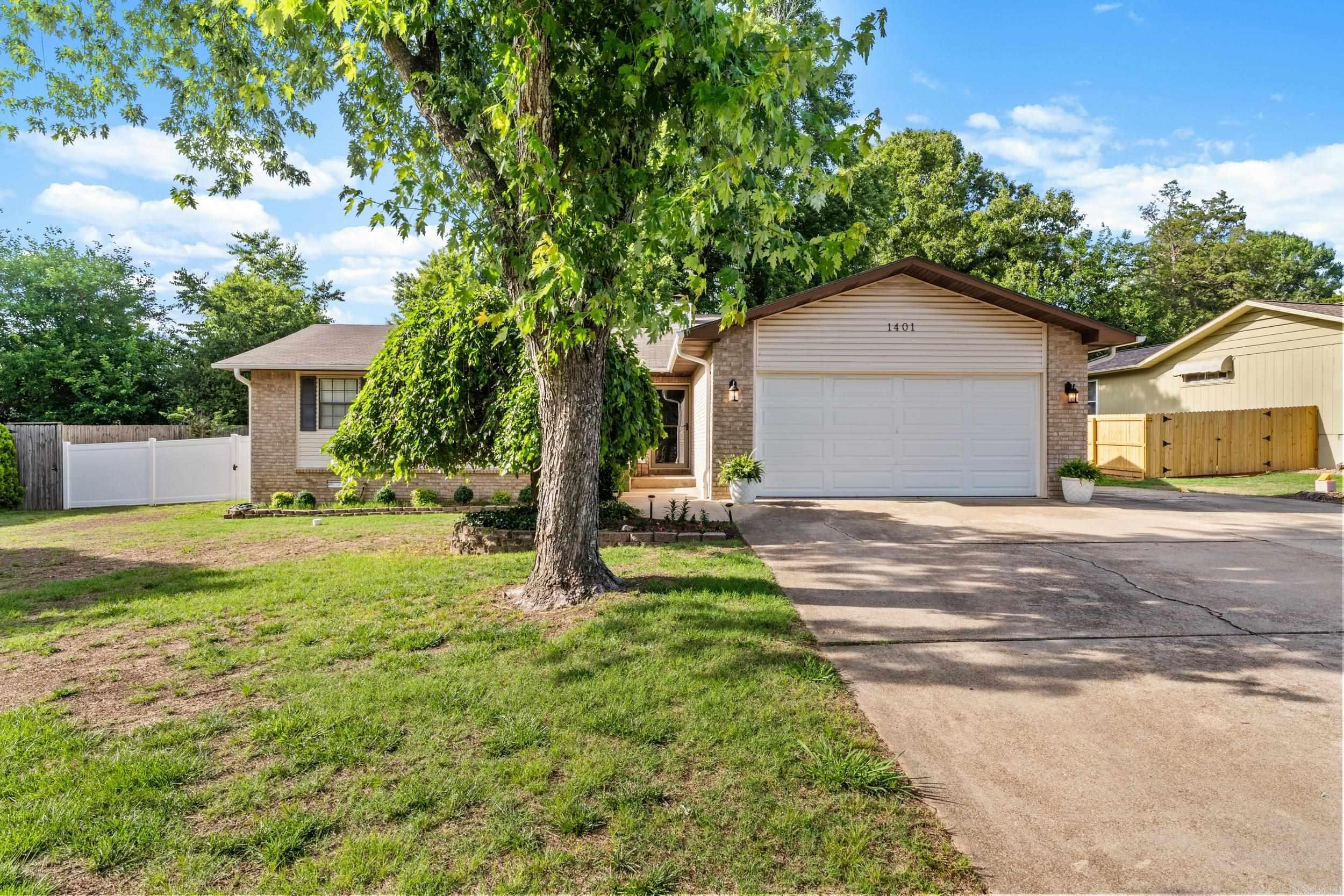 Situated in the desirable Indian Creek Subdivision, this 4-bedroom, 2.5 bath home offers a functional layout and an excellent location close to Cooper Park, schools, and shopping. The spacious living room features a cozy brick fireplace and plenty of natural light. The kitchen provides abundant cabinet space and opens to the dining area, creating an easy flow for everyday living. The primary suite offers privacy and comfort, while the additional bedrooms provide flexibility for family, guests, or office use. A bonus room adds valuable extra space for a second living area, playroom, or hobby room. Outdoors, enjoy a fully fenced backyard with room to relax, entertain, or let pets play. The extra parking pad is ideal for a camper, boat, or 5th wheel, giving you the extra storage space many buyers are looking for. Complete with a 2-car garage and great curb appeal, this is a must-see home in a great neighborhood.