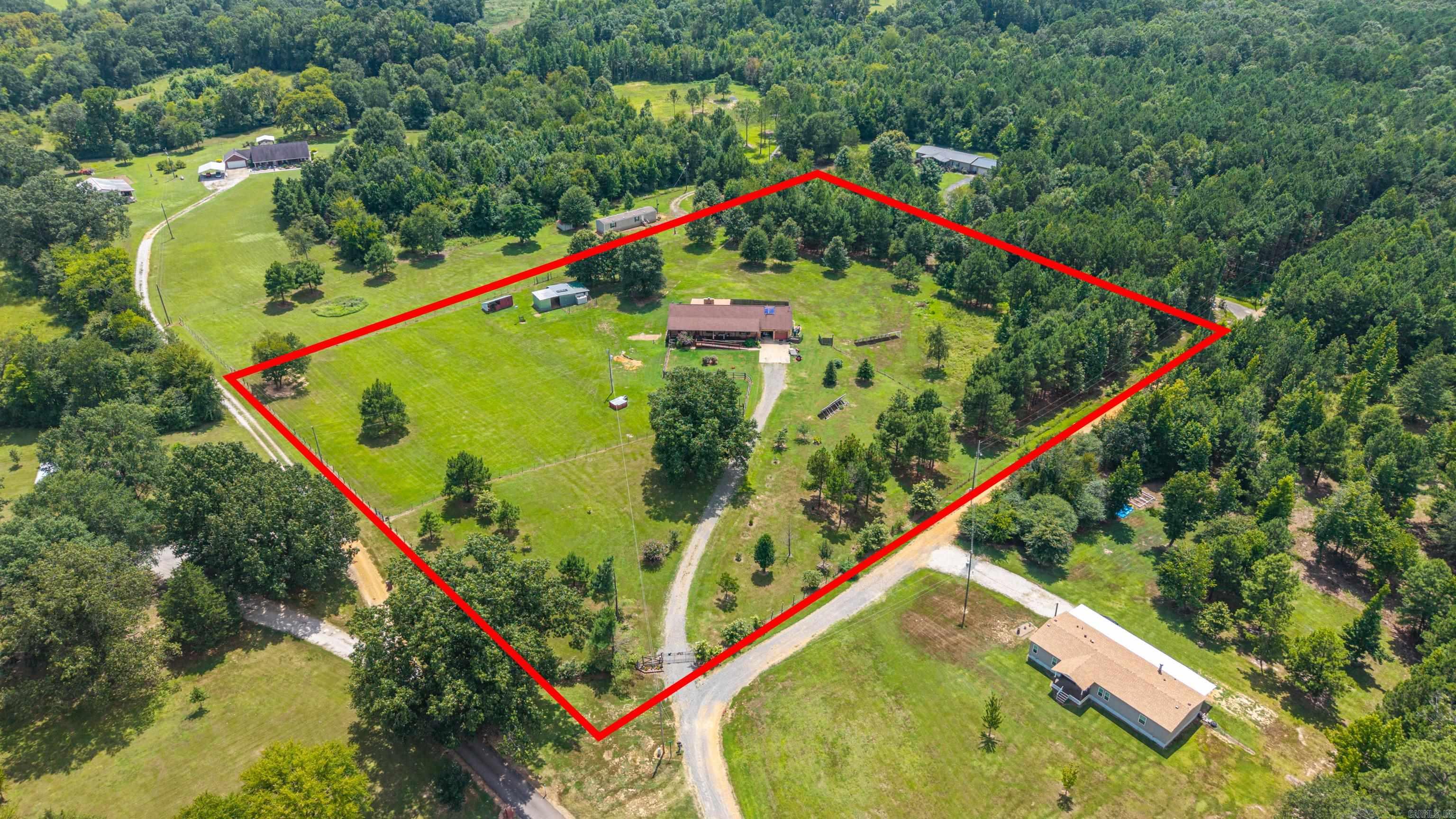 Welcome to peaceful country living in the desirable Ouachita School District! This well-built, solid brick home sits on 6.18 beautiful, fully fenced acres, offering privacy, room to roam, and plenty of space for animals or hobbies. Inside, you’ll find a spacious floor plan featuring an oversized primary suite, a large laundry room, and a cozy fireplace that creates a warm, inviting atmosphere. The oversized two-car garage includes an additional workshop area, making it perfect for projects, storage, or extra workspace. Step outside to enjoy the covered back porch—an ideal spot for relaxing or entertaining. If you’re looking for a quality-built home with acreage, functionality, and country charm, this property is a must-see! AGENTS see notes for more information.