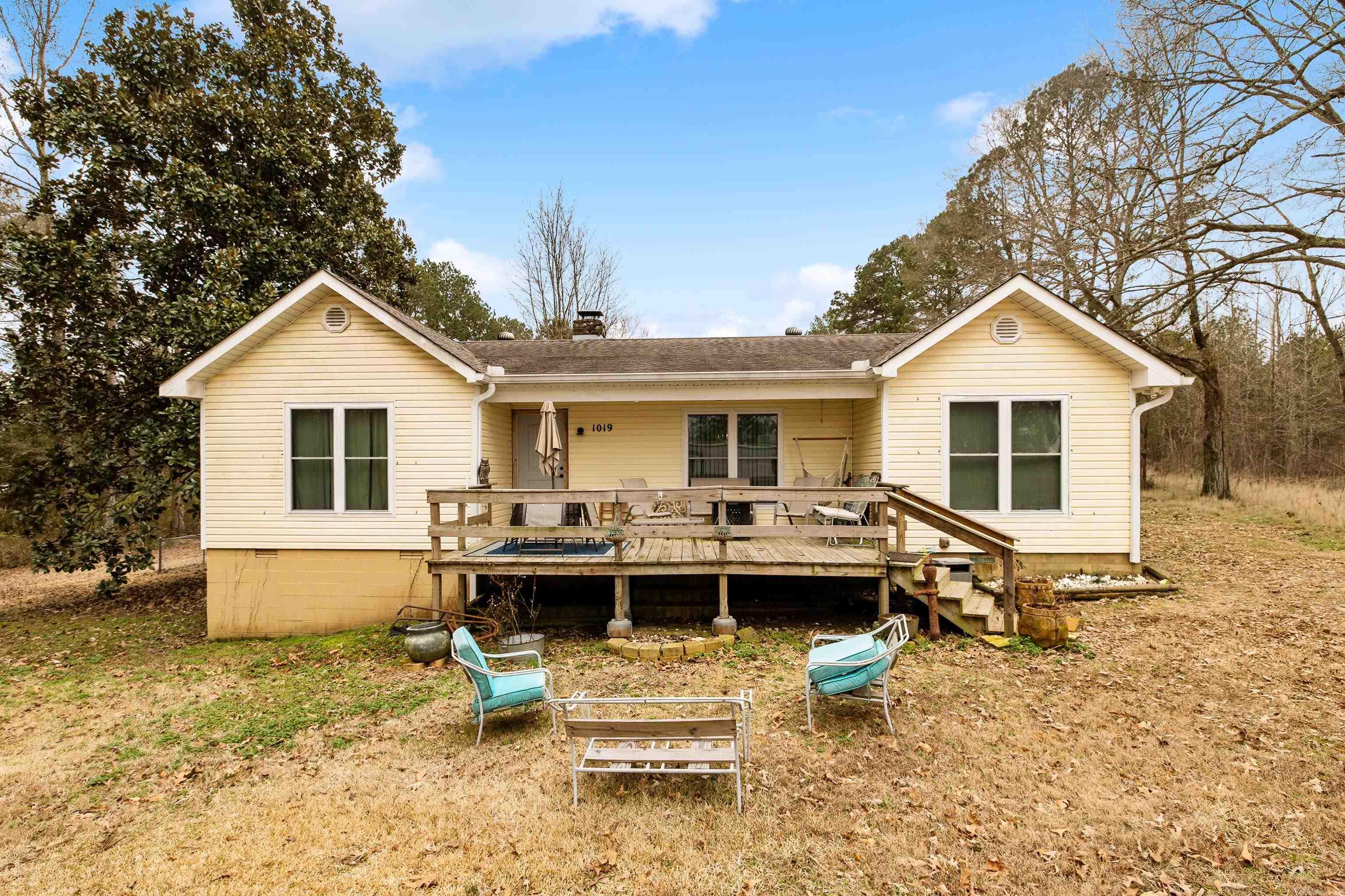 Come see this solid, well maintained home sitting on 1.50 acres. This home is an open floor plan to living room and dining room with a galley style kitchen. As you walk in, you are greeted with a large stone wood burning fireplace. Perfect for those long winter nights. Primary bedroom is spacious and just off the living room, with 2 additional rooms opposite side of the house. Just out back, is a large barn and shop, both with electricity. This is a great starter home or for someone wanting to down size. Agents see remarks