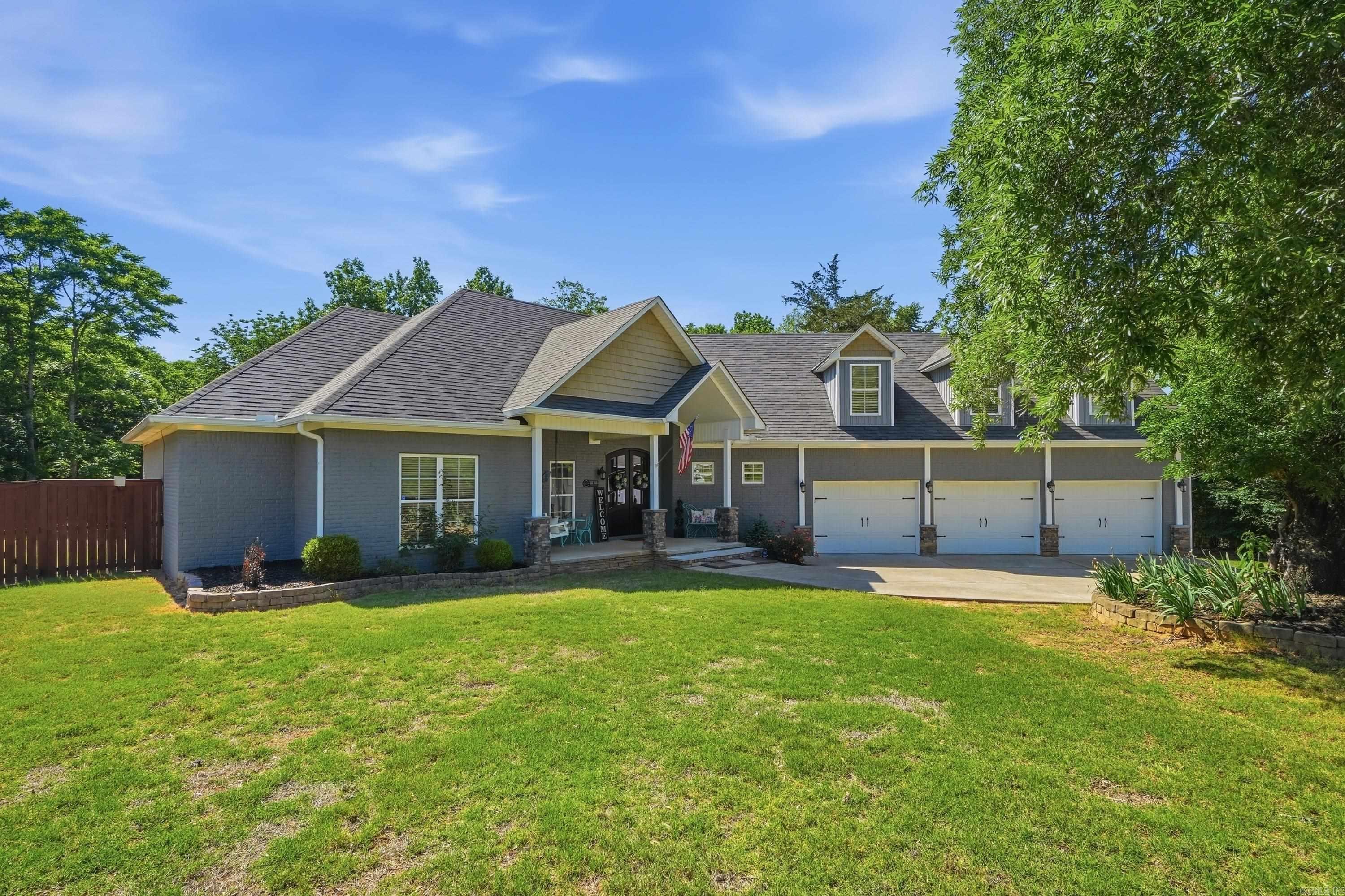 *New Carpet Allowance Offered* Welcome to 4 Evergreen Cove in Greenbrier, Arkansas, a beautifully maintained home tucked away on nearly an acre in a quiet cul de sac. This home is perfect for buyers searching for spacious homes in Greenbrier AR with a quality finishes, flexible living space, shop, on a large lot. This 4 bedroom, 3.5 bathroom home features an open, split floor plan w/ quality finishes throughout, including custom cabinets, granite kitchen countertops, and extensive crown molding. A stunning two sided fireplace between the living spaces. The oversized primary suite includes double vanities & two closets. The upstairs bonus room w/ ull bath is being used as a bedroom & game room. An office on the main level provides additional flexibility for working from home or hobbies. Enjoy outdoor living on the lg covered back porch overlooking a backyard that backs up to mature trees for added privacy and a peaceful setting. The property also includes a 3 car attached garage plus a 2 car detached shop/garage, giving you plenty of room for vehicles, storage, boats, or projects. Located in the desirable Greenbrier area with top rated schools. Schedule your private showing today!