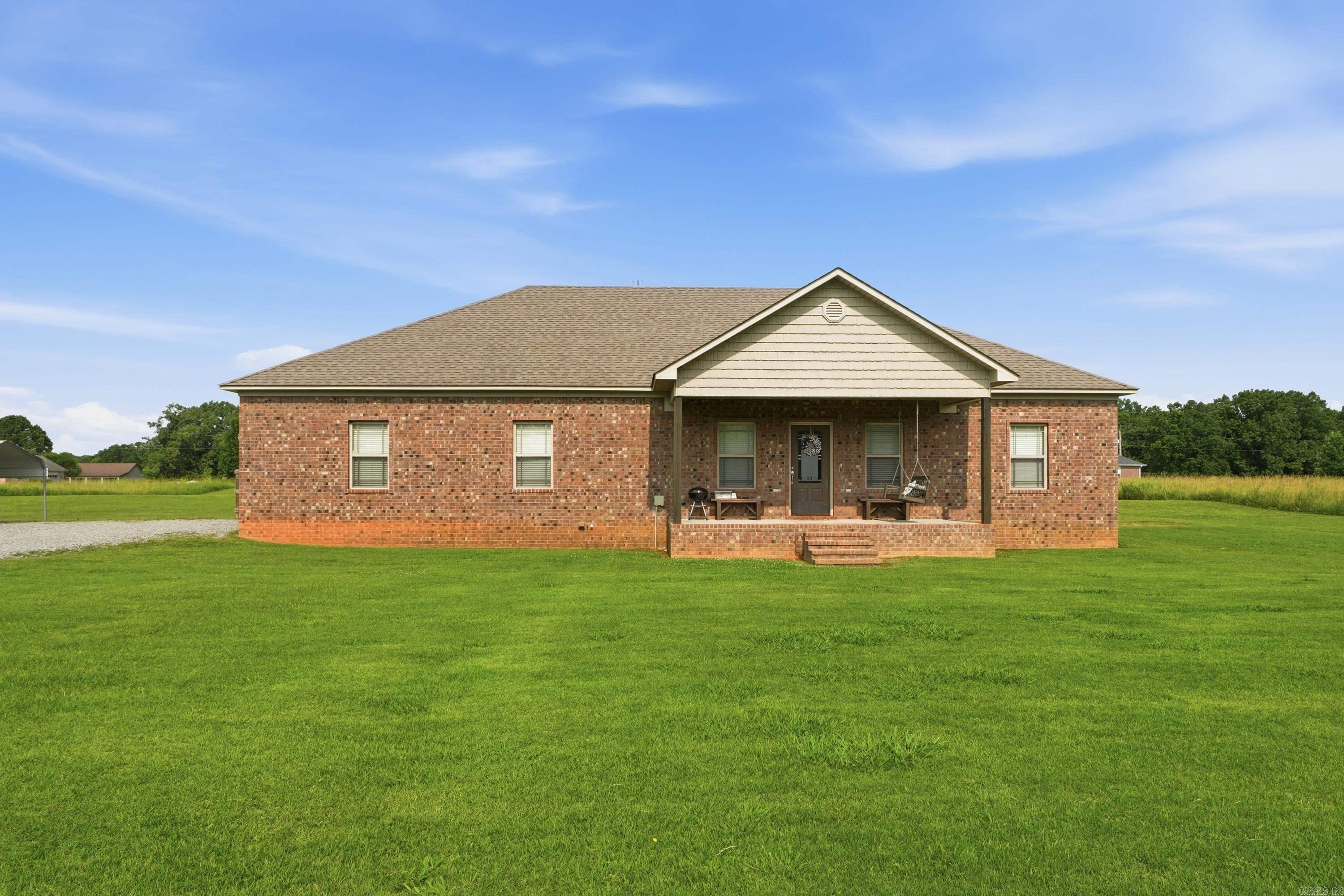 Welcome home to peaceful country living with all the modern conveniences! Built in 2017, this beautiful brick home offers 3 bedrooms, 2 bathrooms, and nearly 1,900 square feet of well-designed living space on just under 5 acres in Mount Vernon. Inside, you’ll find an inviting open-concept layout that’s perfect for entertaining, along with a split-bedroom floor plan that provides privacy for the spacious primary suite. The kitchen flows seamlessly into the living and dining areas, creating a warm and functional space for everyday living. Step outside to enjoy the fenced backyard, ideal for children, pets, or simply relaxing while taking in the peaceful country setting. With plenty of acreage, you’ll have room to garden, play, or enjoy the outdoors while still being just a short drive from nearby amenities. If you’ve been searching for a newer home with land, privacy, and modern finishes, this one checks all the boxes. Schedule your private showing today