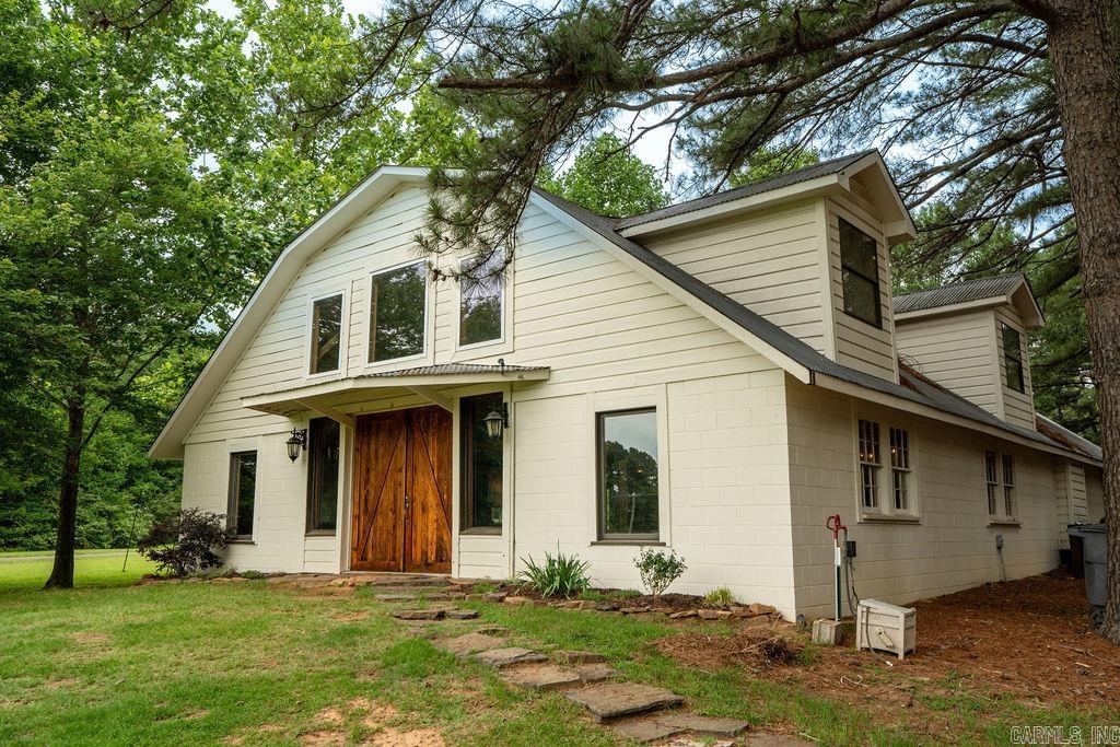 HGTV and Magnolia Network worthy, this stunning converted barn is a designer's dream! Offering over 4,800 sq ft, this gorgeous space features 5 bedrooms, 3 bathrooms, 2 loft areas, multiple living areas, and endless space for entertaining. Situated on 1.44 acres, you'll enjoy a peaceful, country-like setting with the convenience of being in town. Located just moments from the country club, golf, swimming and dining are nearby. A one-of-a-kind property full of charm, character, and possibilities!!