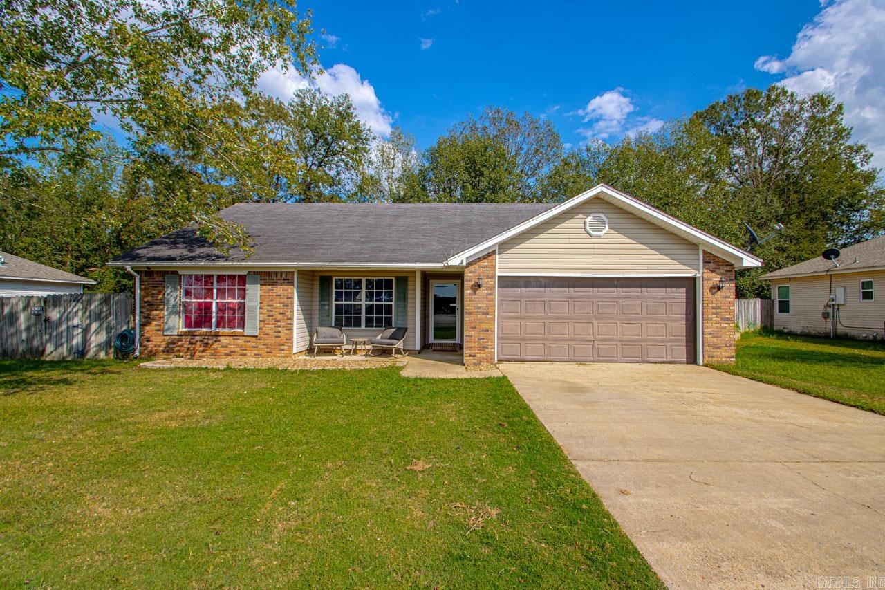 Your Greeted by this Open Floorplan home featuring a Rock Fireplace ~ Vaulted Ceilings and Breakfast Bar. This home offers Three Bedroom 2 Full Bathrooms and a Bonus Office/Craft Room. Fema Approved Safe Room. Covered back patio and Storage Building in the fully fenced backyard.