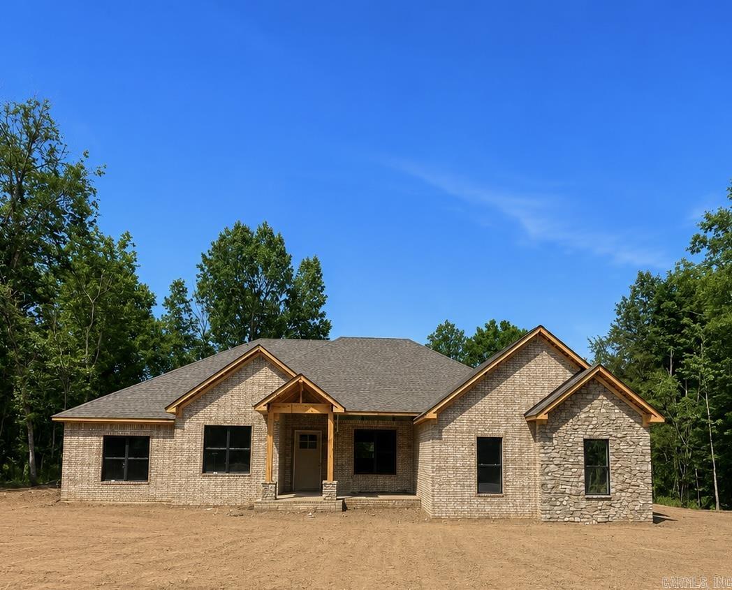 New construction underway in the gated subdivision of Devoe Bend by Daryl Brock Custom Homes. This stunning one-level residence is designed with today’s buyer in mind, offering 4 spacious bedrooms, 3.5 baths, and approximately 2,956 square feet. The home includes a 3-car garage and is situated on a level lot with picturesque views of the Bayou, plus greenspace at the back. Enjoy the neighborhood’s natural walking trails and tranquil setting. Quality construction features include ZIP System sheathing, TechShield roof decking, foam-insulated exterior walls, and a tankless water heater for energy efficiency. Interior selections are still available, allowing you to customize finishes and make this home your own. Built with craftsmanship and attention to detail, this property blends comfort, efficiency, and elegance in one of Maumelle’s most desirable gated communities.
