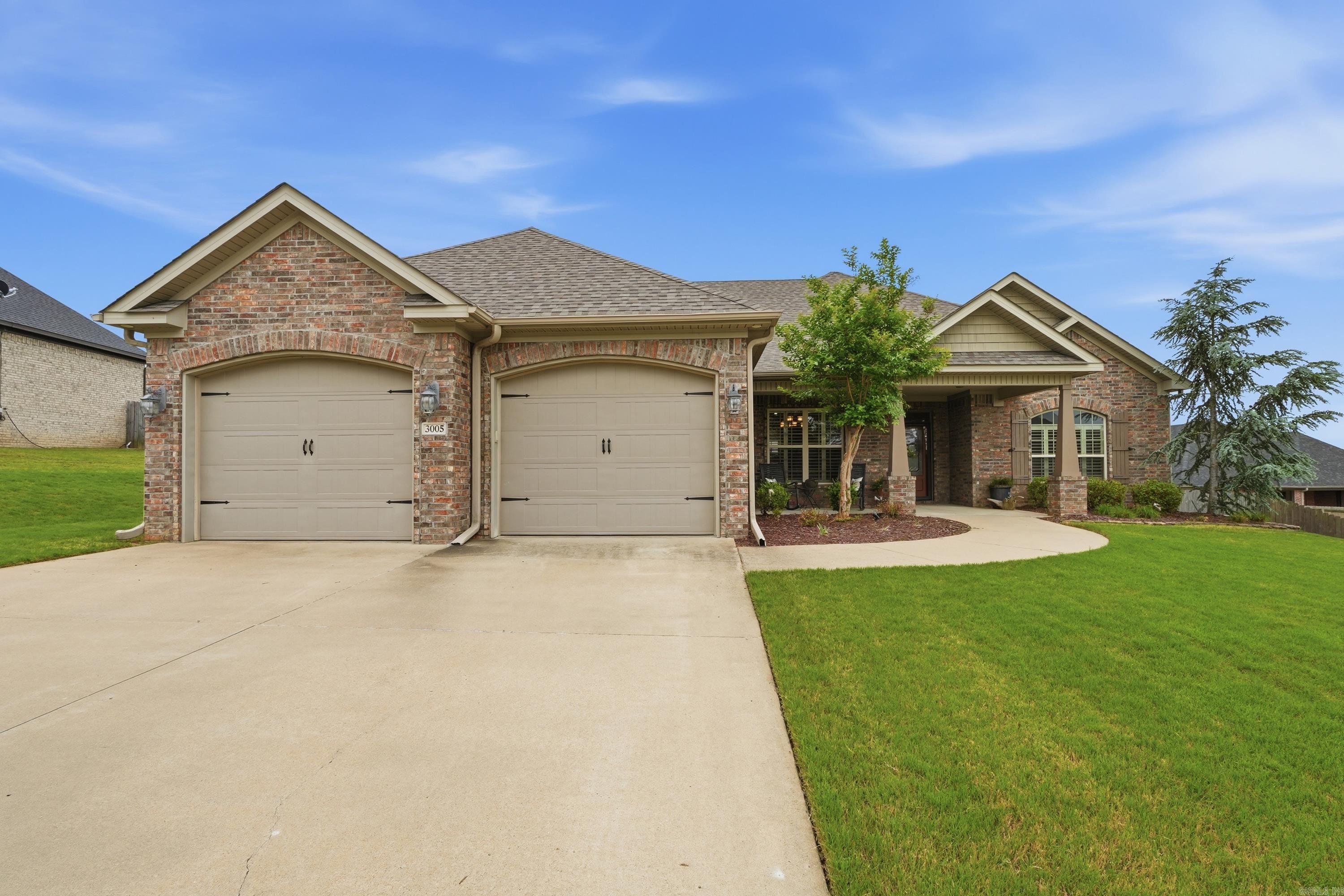 Immaculate, move-in ready home, showcasing pride of ownership throughout. Enjoy mornings on the inviting covered front porch and evenings on the shaded covered back patio. Inside, you’ll find beautiful hardwood floors, plantation shutters, and a thoughtfully designed split 4-bedroom floor plan. The spacious primary suite offers a closet that connects directly to the laundry room with sink. The oversized, extra-insulated garage features a drop-down attic hose system, making it easy to vacuum cars / garage—plus a generous floored attic for storage. The kitchen includes an oven with a built-in air fryer, and energy-efficient construction helps keep utility costs low. Located in a desirable neighborhood with a park and pond which you see in the pictures!