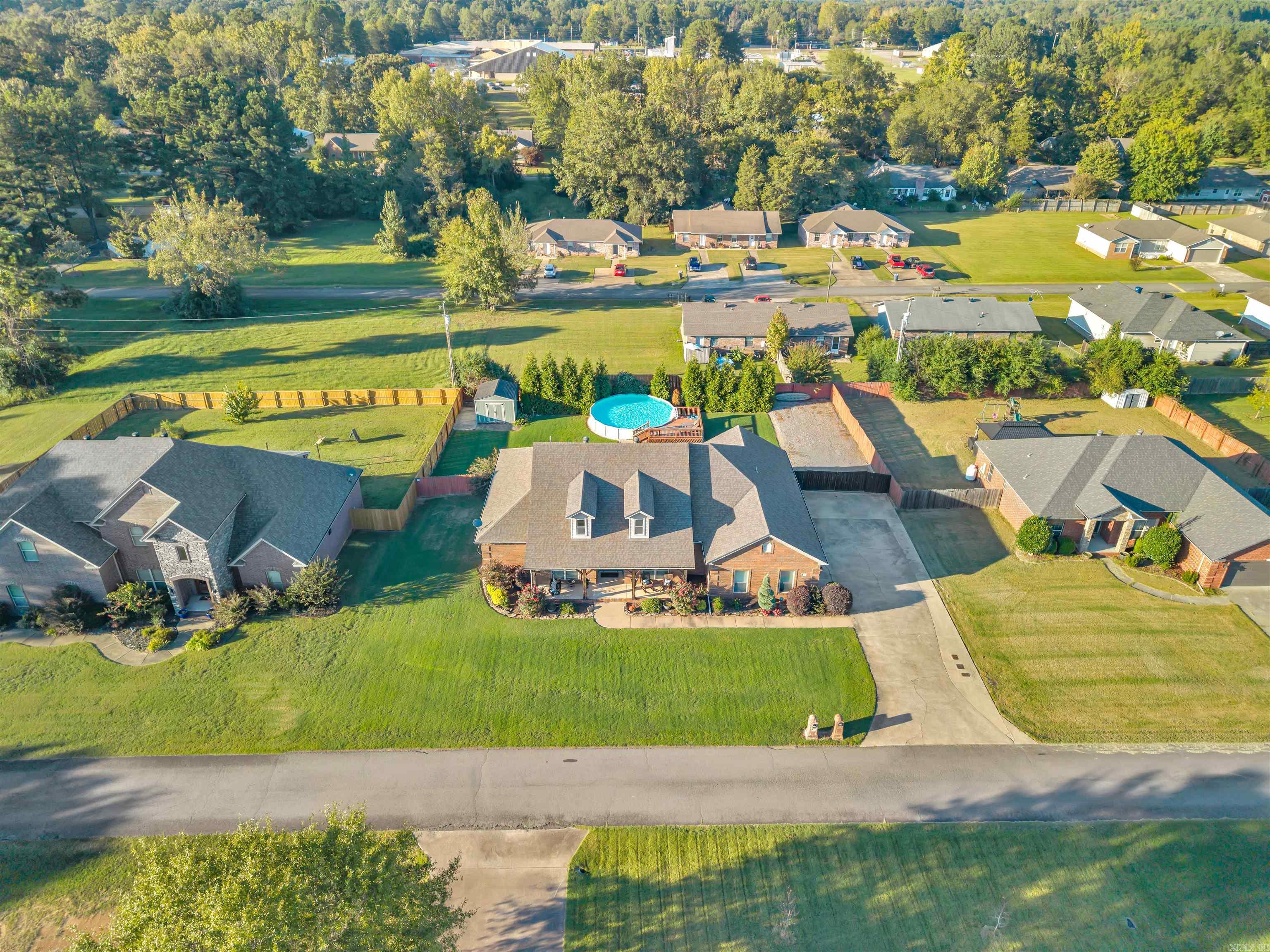 This beautiful Perryville home truly has it all! Featuring 4 bedrooms and 2 bathrooms with a thoughtful split floor plan, the layout flows seamlessly from room to room. The living area showcases a fireplace and tray ceiling, adding extra character and charm. Step outside to a spacious backyard complete with an above-ground pool—perfect for those hot Arkansas summers. Relax on the covered back patio, catch the game, and enjoy the privacy of your fenced yard. Additional highlights include a lawn sprinkler system, a shed, and a parking pad for your boat or RV. Plus, working from home is a breeze with fiber internet through Connect2First!