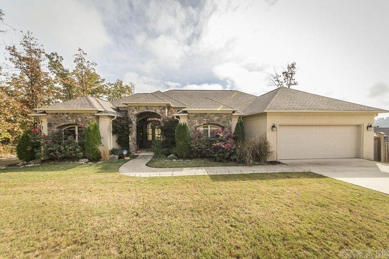Customized appointed home, stunning views, open spacious floor plan, divine foyer entry,  formal dinning, breakfast bar, breakfast area, pantry in a cabinet filled kitchen. Master suite is separate, has sitting area, mst.bath has double vanity walk in shower, custom closet! Separate laundry, garage has a built in storm shelter, other bedrooms have great closets! You will enjoy the salt water heated pool with custom water feature, extra landscaping makes this a haven for any day!