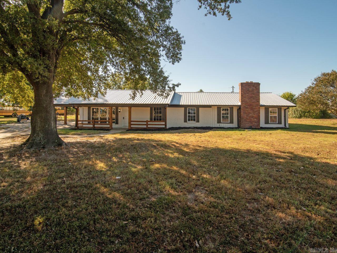 Welcome to your new home! This property is as fine as country living gets! It embodies all the modern conveniences you want or need yet located in a rural area. It is located in a secluded area yet close to shopping, hospital, and schools. This property has been totally remodeled including a new kitchen with new countertops, new flooring, new cabinets, new sink, and stainless-steel appliances. The bathrooms are gorgeous. They include new modern vanities, flooring, bath & shower with new large shower heads, beautiful mirrors, and light fixtures. This home also boasts 2 living areas including a huge den for family night. There is also a fireplace located in the den. To recap, throughout the house, there is new paint, new light fixtures, new flooring, new windows, & so much more.  Let's talk about the exterior. The exterior bricks have been painted. There are new custom shutters, newly installed posts in the front that are freshly stained. There is a metal roof which lasts an average of 40-70 years. Did I mention the HUGE mancave/shop out back? Wow! All of it is situated on over a half-acre lot which is plenty of room for the animals and kids to roam & play. BUYER'S FINANCING FAILED!