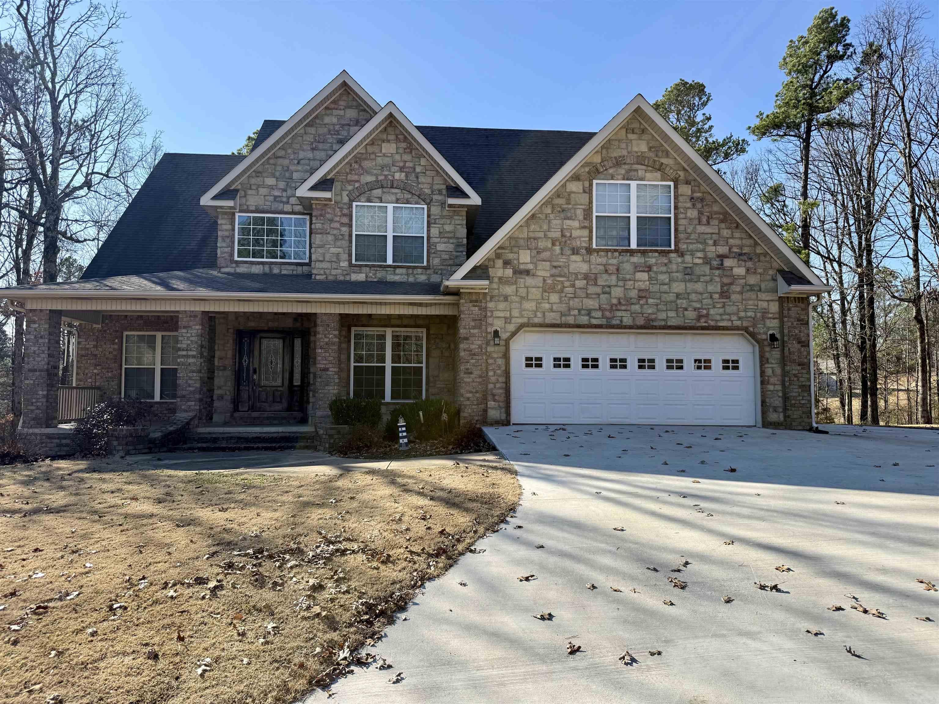 Located in a quiet cul-de-sac on the west side of Paragould, this spacious 5-bedroom, 3.5-bath home offers a versatile layout with room for everyone. A welcoming two-story foyer opens to inviting living spaces filled with natural light and a beautiful stone fireplace. The home features two primary suites—one on the main level and one upstairs. The main-level primary bath includes a custom tiled walk-in shower, while an upstairs bath also offers a walk-in shower.  The kitchen includes a breakfast bar, breakfast area, and flows easily into the formal dining room—perfect for everyday living or entertaining. A dedicated office provides great work-from-home space. Enjoy outdoor living on the new deck, complete with a storm shelter underneath for added peace of mind. A storage building conveys for extra convenience. Situated in an established subdivision, this home offers comfort, flexibility, and a great location.  With an acceptable offer, the Speed Queen washer and dryer may also convey!
