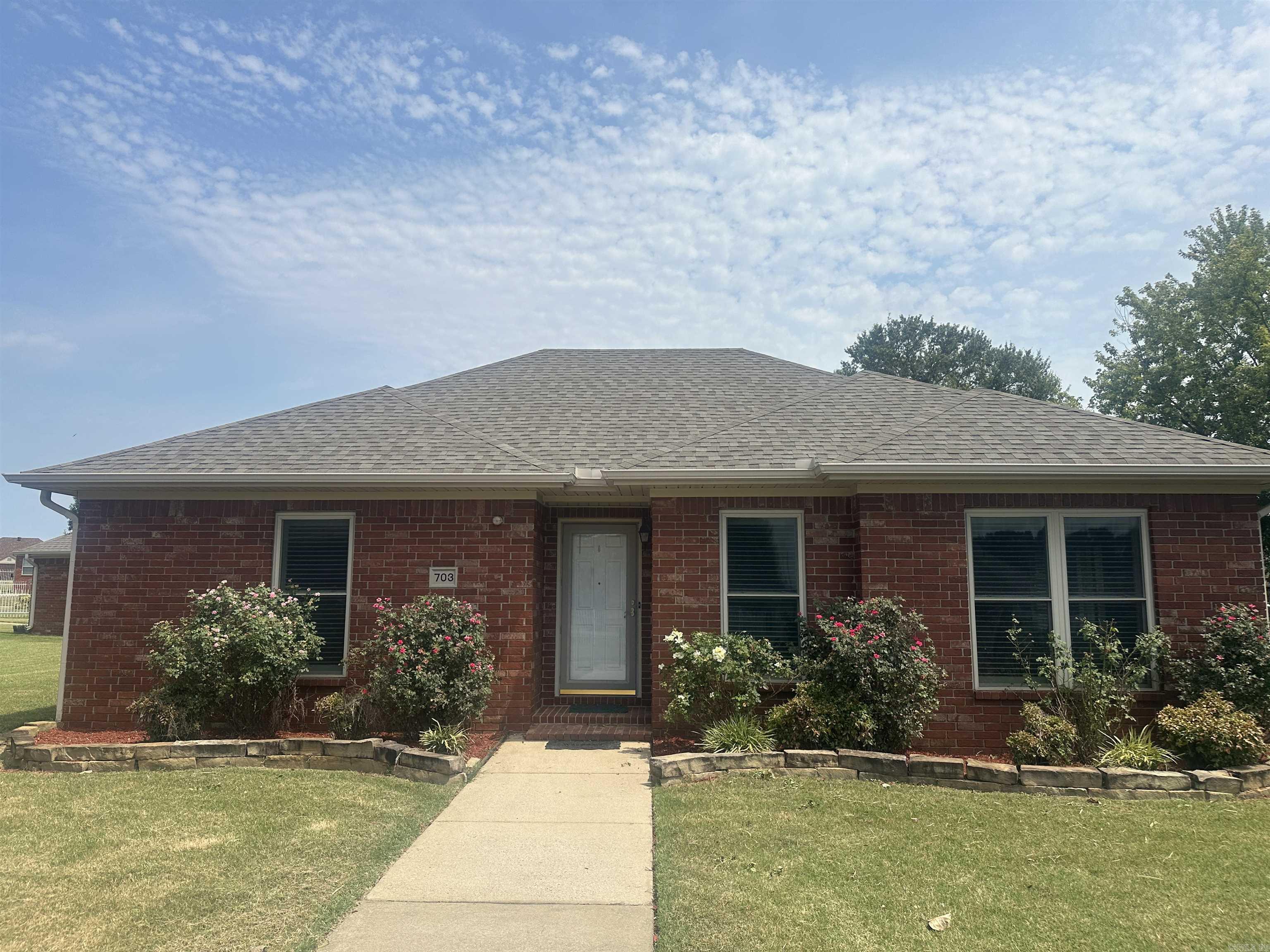 Beautiful improvements to include solid surface counters and gray accent backsplash in kitchen. Plantation blinds on all windows!  Floors have all been updated.  Very popular walk in tub in hall bath with jets.  Full walk in shower in primary bathroom. Hot water heater and microwave updated as well. New roof in 2022. Storm shelter in garage also.  Freshly painted and move in ready!  Over 55 neighborhood with yard care provided and sprinkler systems in yard,.  Gated area for security.  Rear drive way to garage.