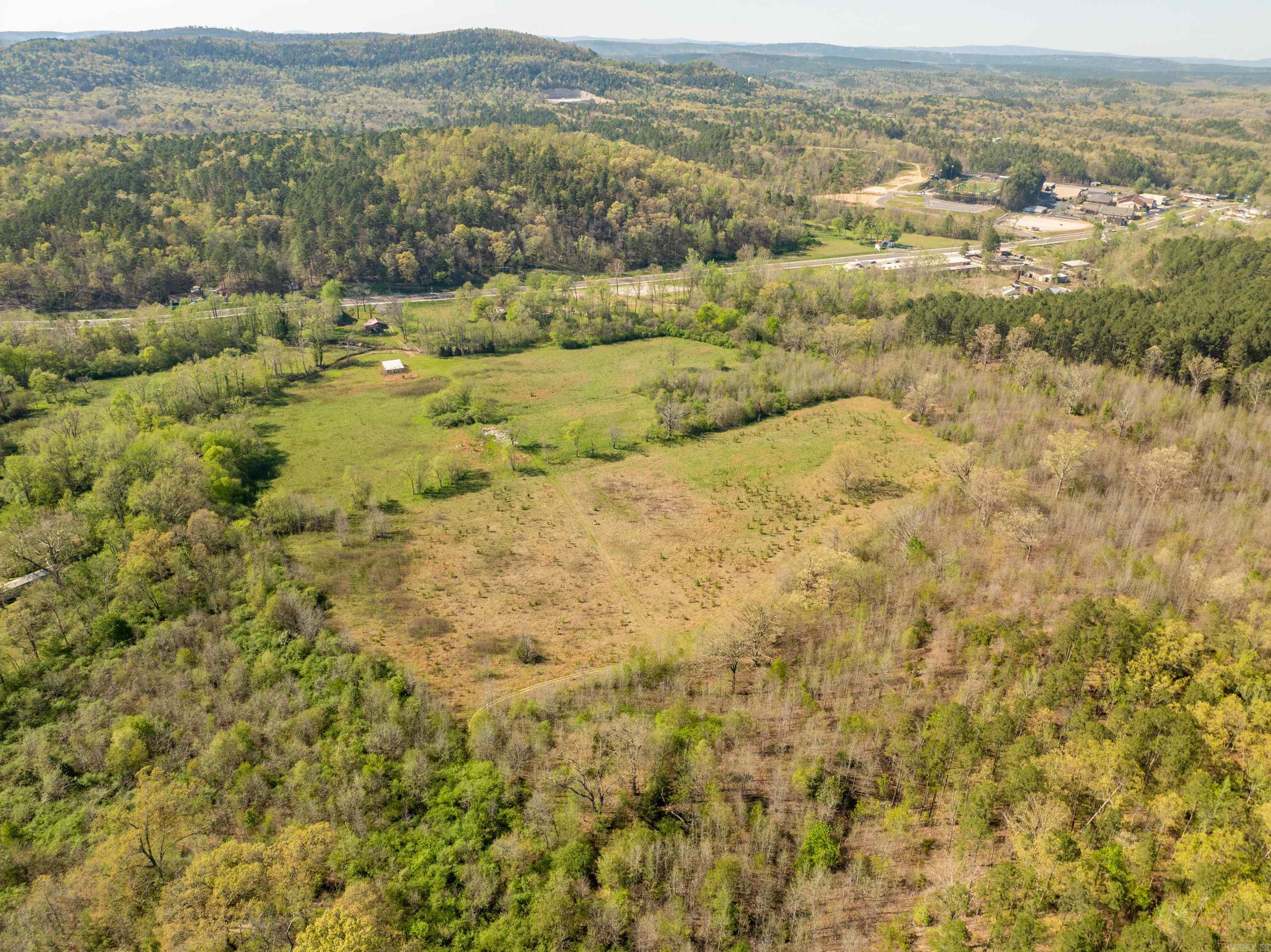 Amazing opportunities abound! 62 acres conveniently located just one mile from the new MLK bypass. Year round creek perfect for developing creekside lots.. The possibilities are endless. This offering does not include 3008 sf home located at front of property. See MLS No. 25022553.